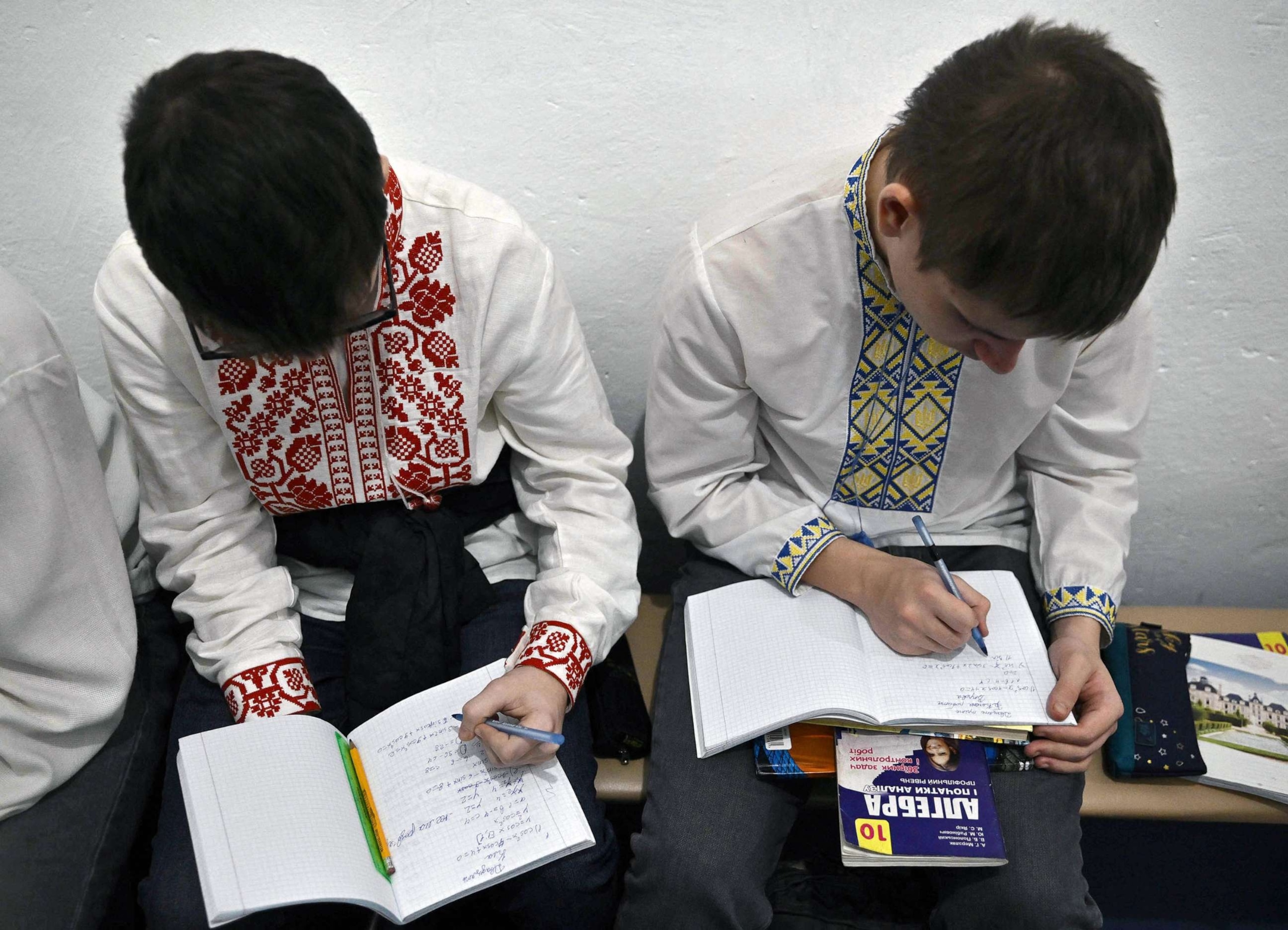 PHOTO: FILE - Children study in an air-raid shelter in the cellar of a school after an alarm signal in Kyiv, March 23, 2023, amid the Russian invasion of Ukraine.