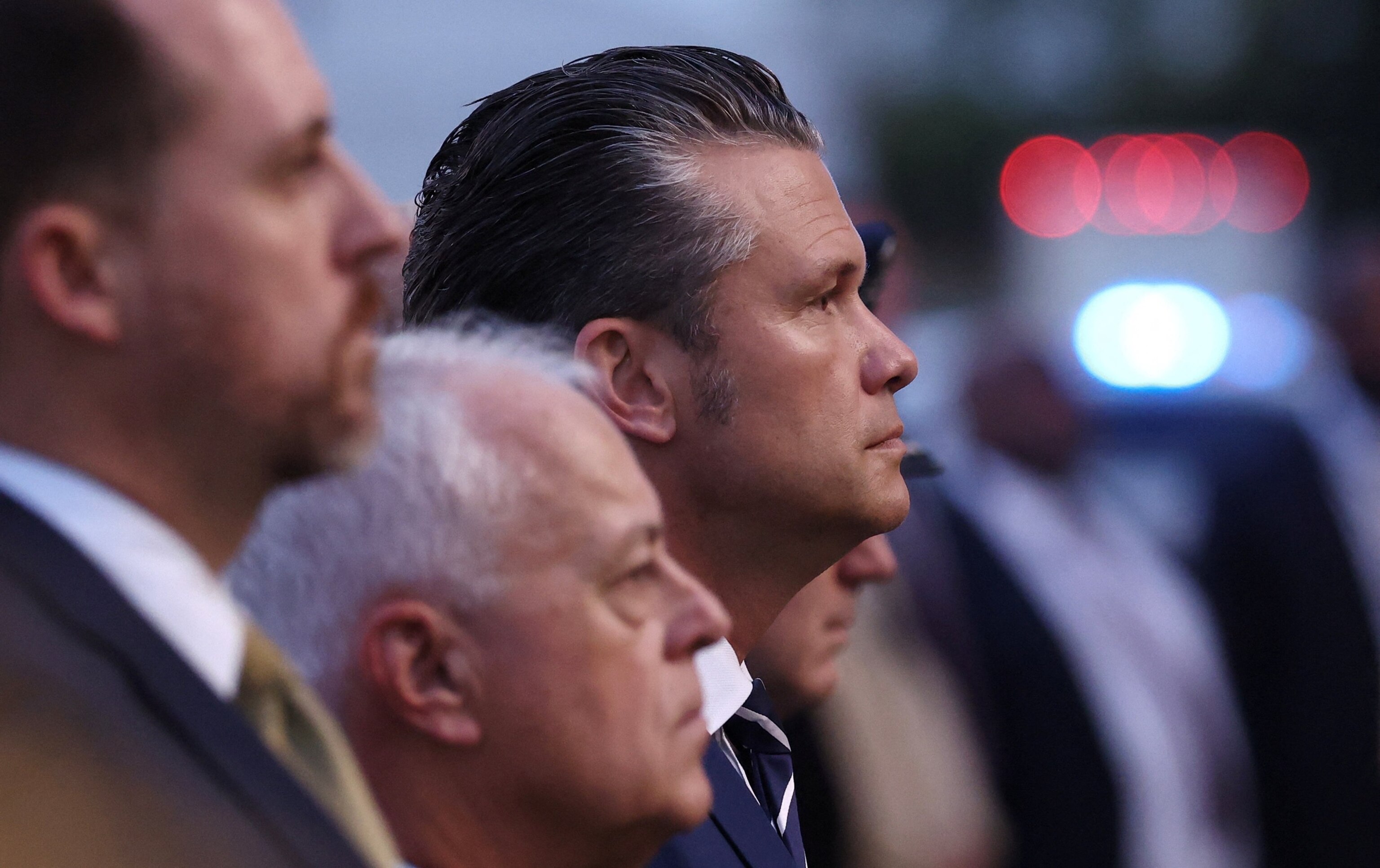 PHOTO: Secretary of Defense Pete Hegseth listens to proceedings before the unfurling of the U.S. flag from the roof of the Pentagon during a ceremony marking the 24th anniversary of the 9/11 attacks on the United States, in Washington, September 11, 2025.