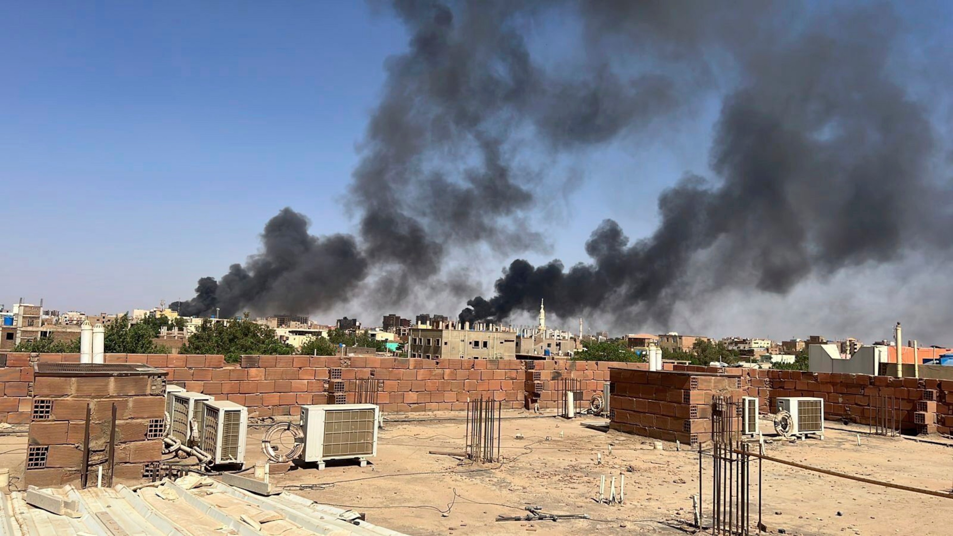 PHOTO: In this photo provided by Maheen S., smoke fills the sky in Khartoum, Sudan, near Doha International Hospital on April 21, 2023.