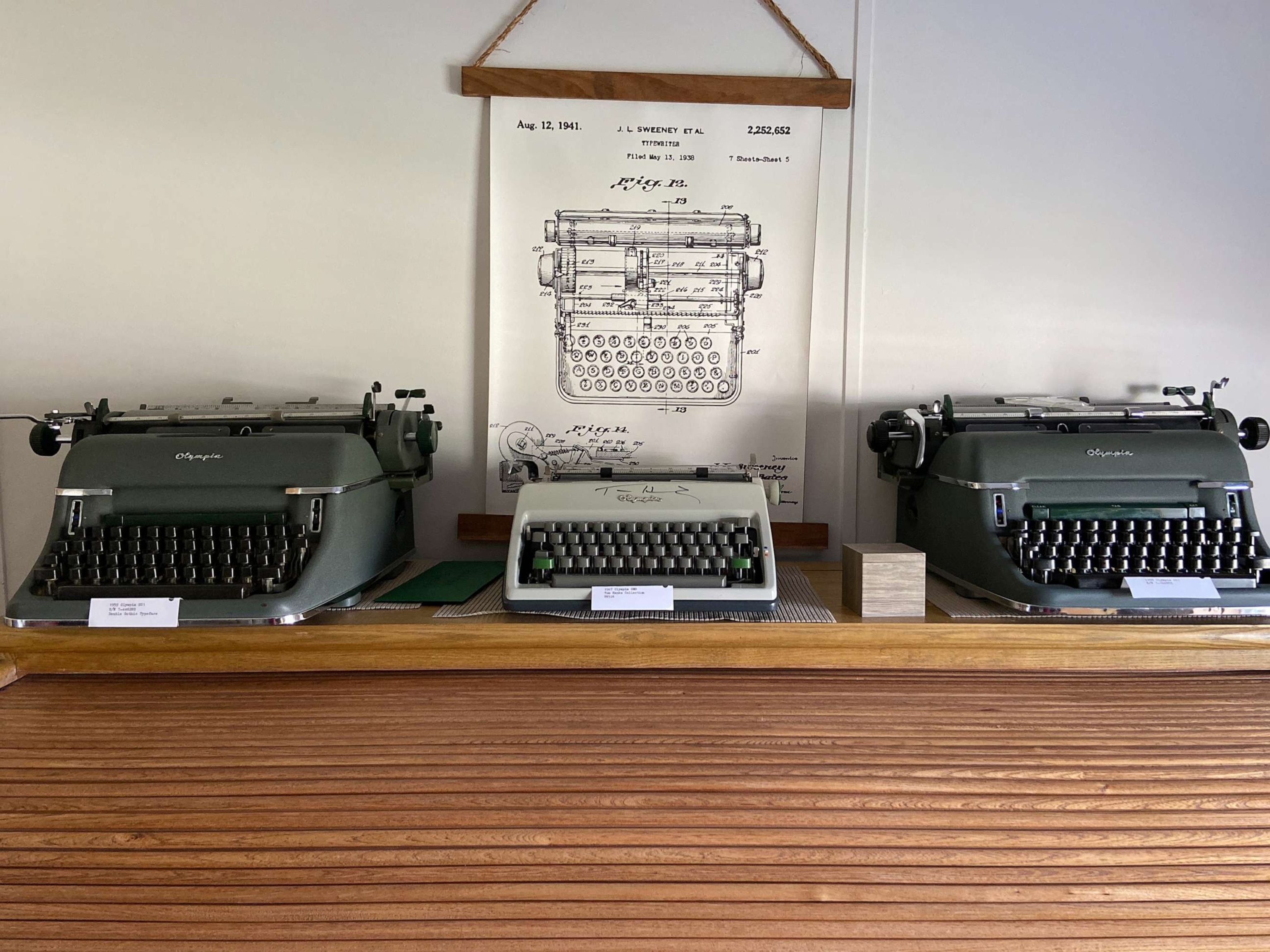 PHOTO: Scott Connors proudly displays the typewriter Hanks gifted him next to two other Olympia models.