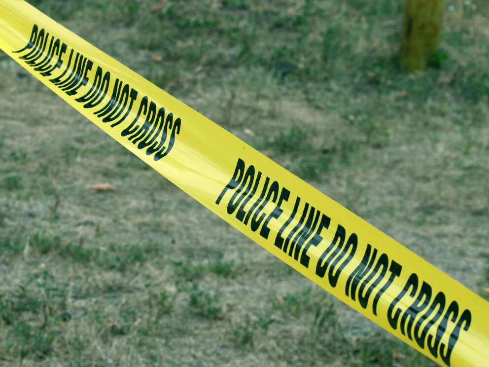 PHOTO: Police yellow warning tape crossing the photo