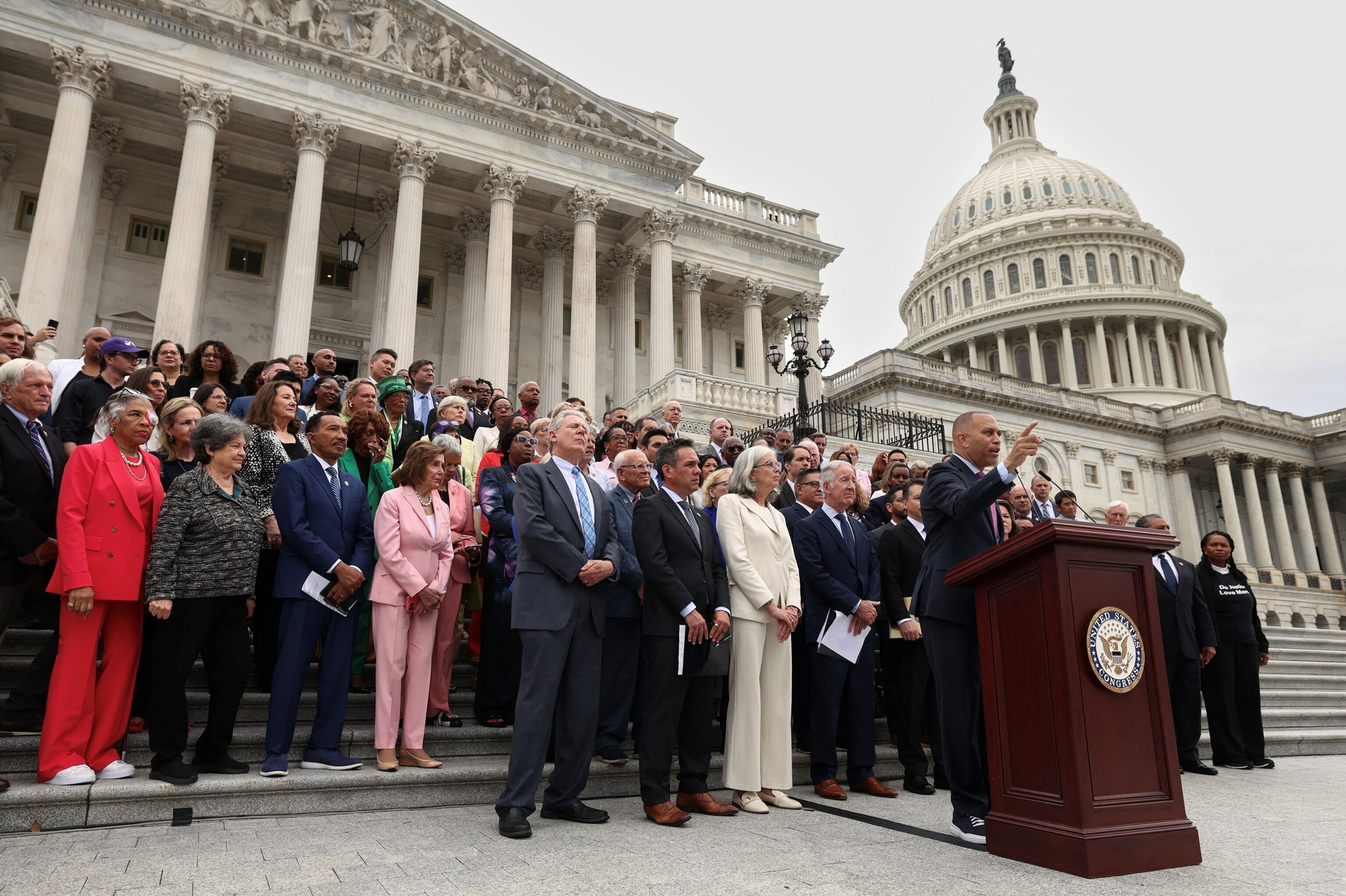 PHOTO: Backed by fellow Democratic House members, House Minority Leader Hakeem Jeffries speaks on the steps of the U.S. Capitol in Washington, July 2, 2025.