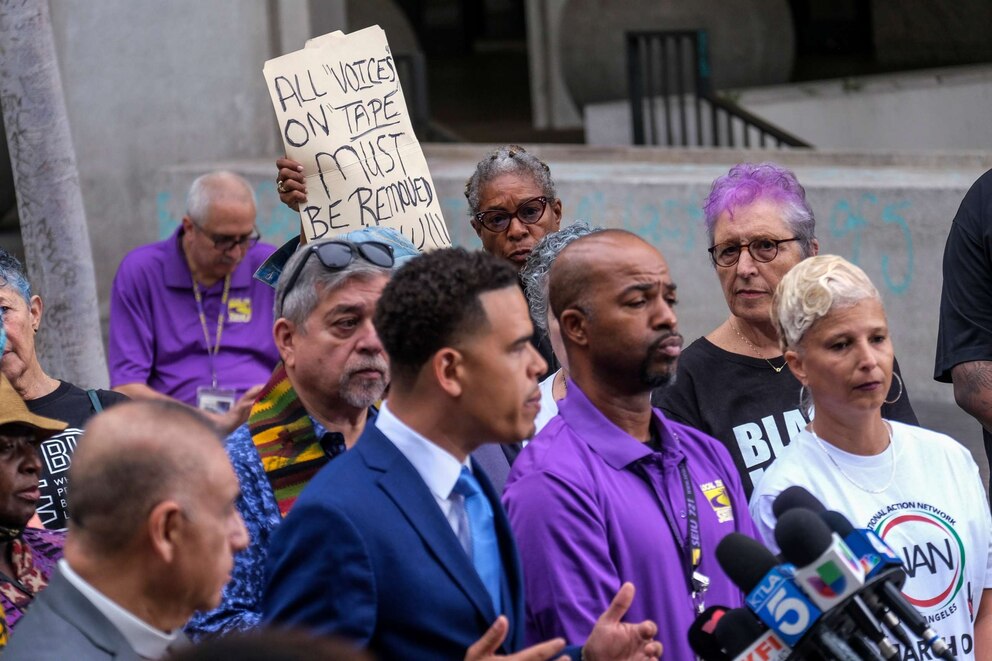 PHOTO: Veronica Sance holds a sign in a news conference to denounce racism and demand change, Oct. 11, 2022 in Los Angeles.