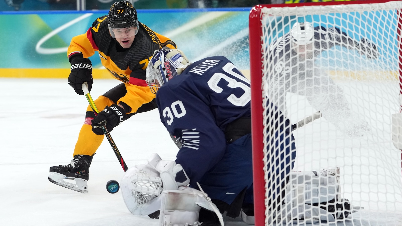 Germany beats France, Switzerland tops Italy to reach men’s hockey quarterfinals