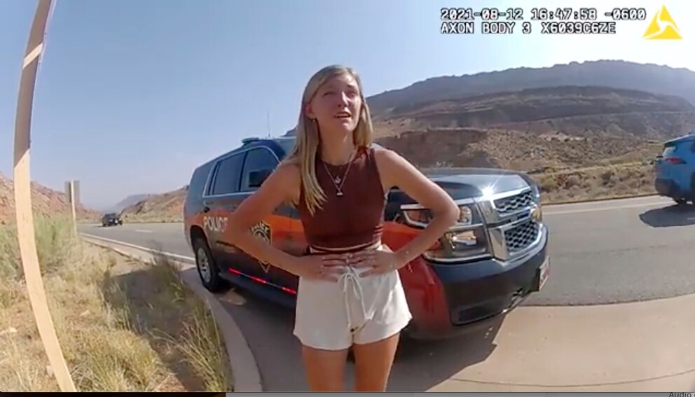 PHOTO: In this image taken from police body camera video provided by the Moab Police Department, Gabby Petito talks to a police officer near the entrance to Arches National Park on Aug. 12, 2021.
