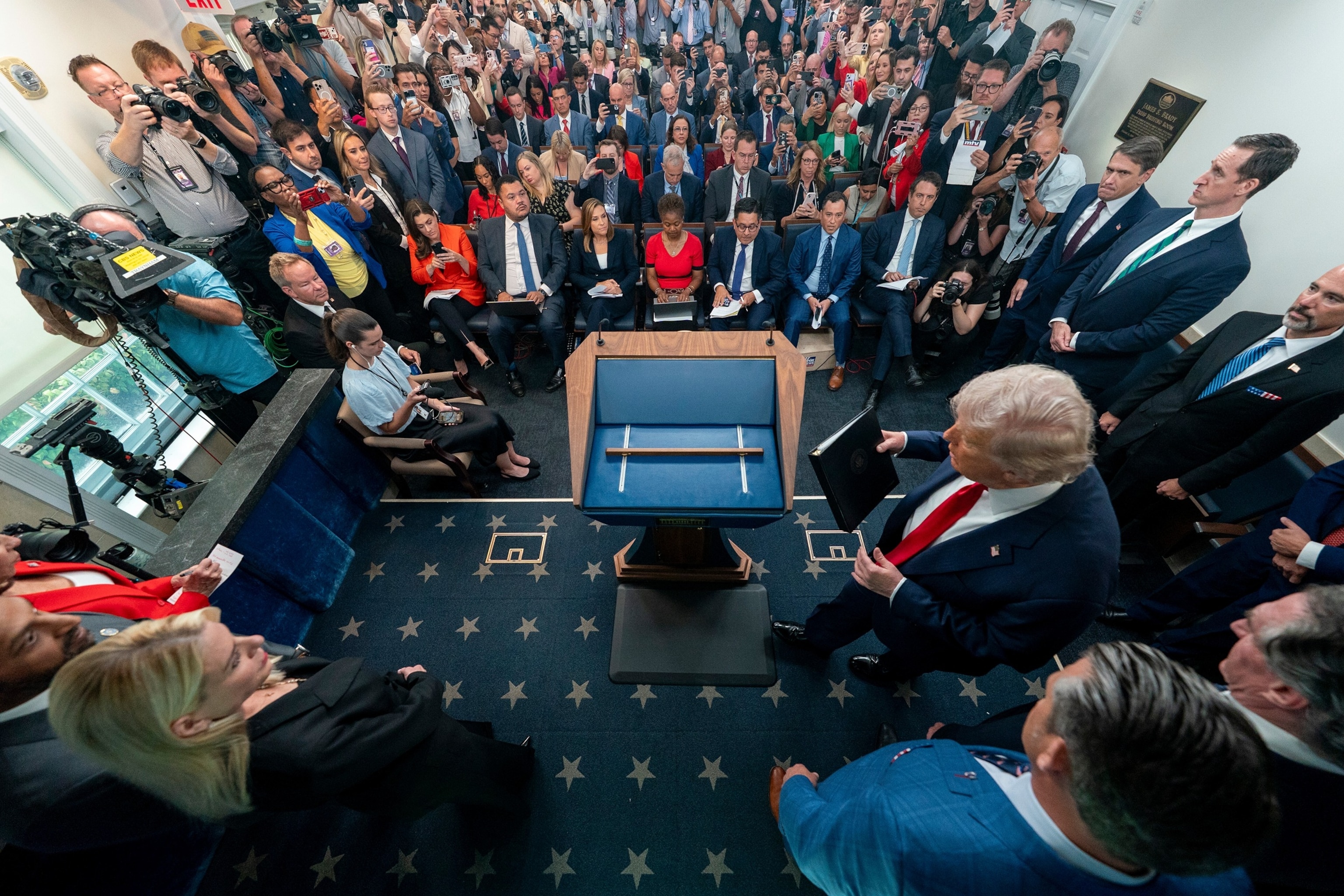 PHOTO: President Donald Trump arrives to speak with reporters in the James Brady Press Briefing Room at the White House, Aug. 11, 2025, in Washington