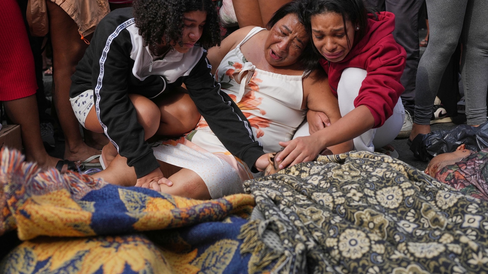 Rio favelas left reeling after lethal gang raid as families bury the dead