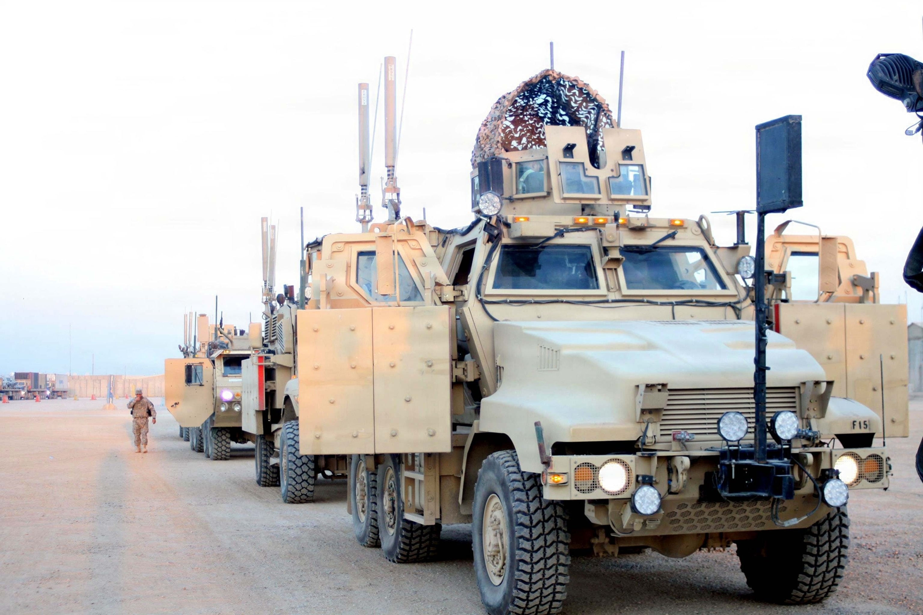 PHOTO: A line of Mine Resistant Ambush Protected vehicles operated by Soldiers with Company F, 3rd Battalion, 116th Cavalry Regiment, 3rd Sustainment Brigade, 103rd Sustainment Command stand ready to begin a convoy at Joint Base Balad, Iraq.