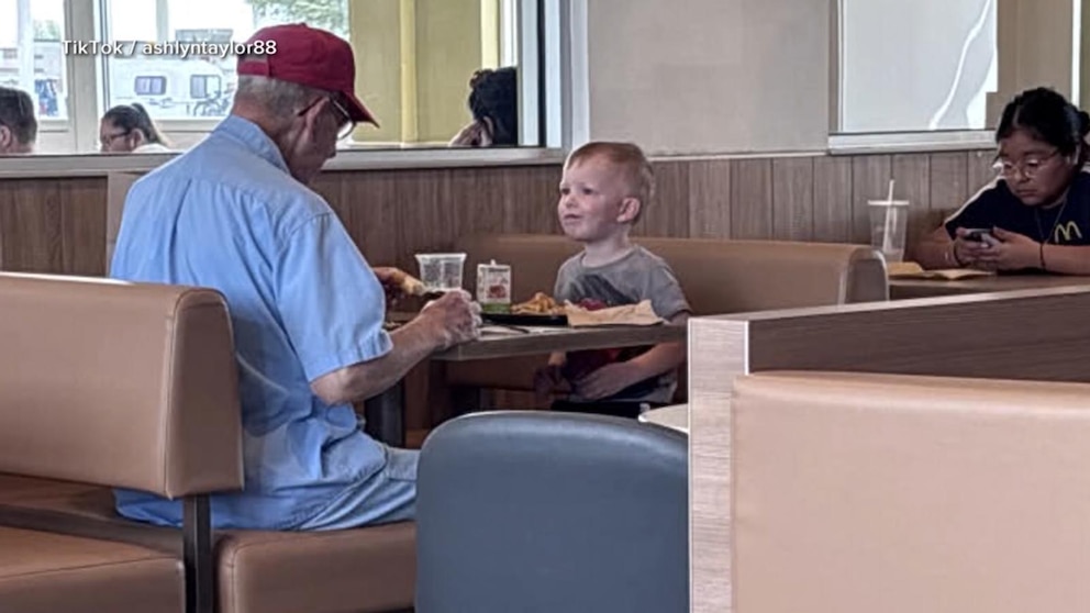 Video Little boy keeps veteran company at breakfast