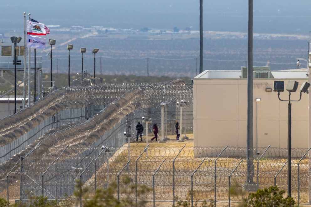 PHOTO: People enter the California City Immigration Processing Center, the state's newest and largest ICE prison, on March 25, 2026, in California City, Calif. 