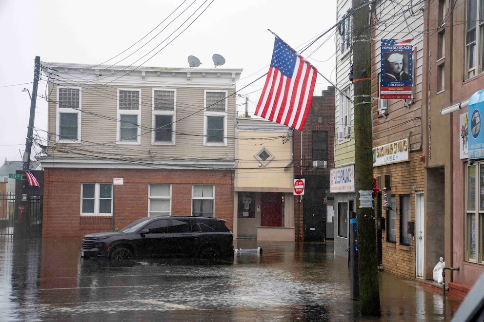 A parked car sits in floodwaters on 159th Street in the Howard Beach neighborhood of the Queens borough on Sept. 27, 2026, in New York, New York.