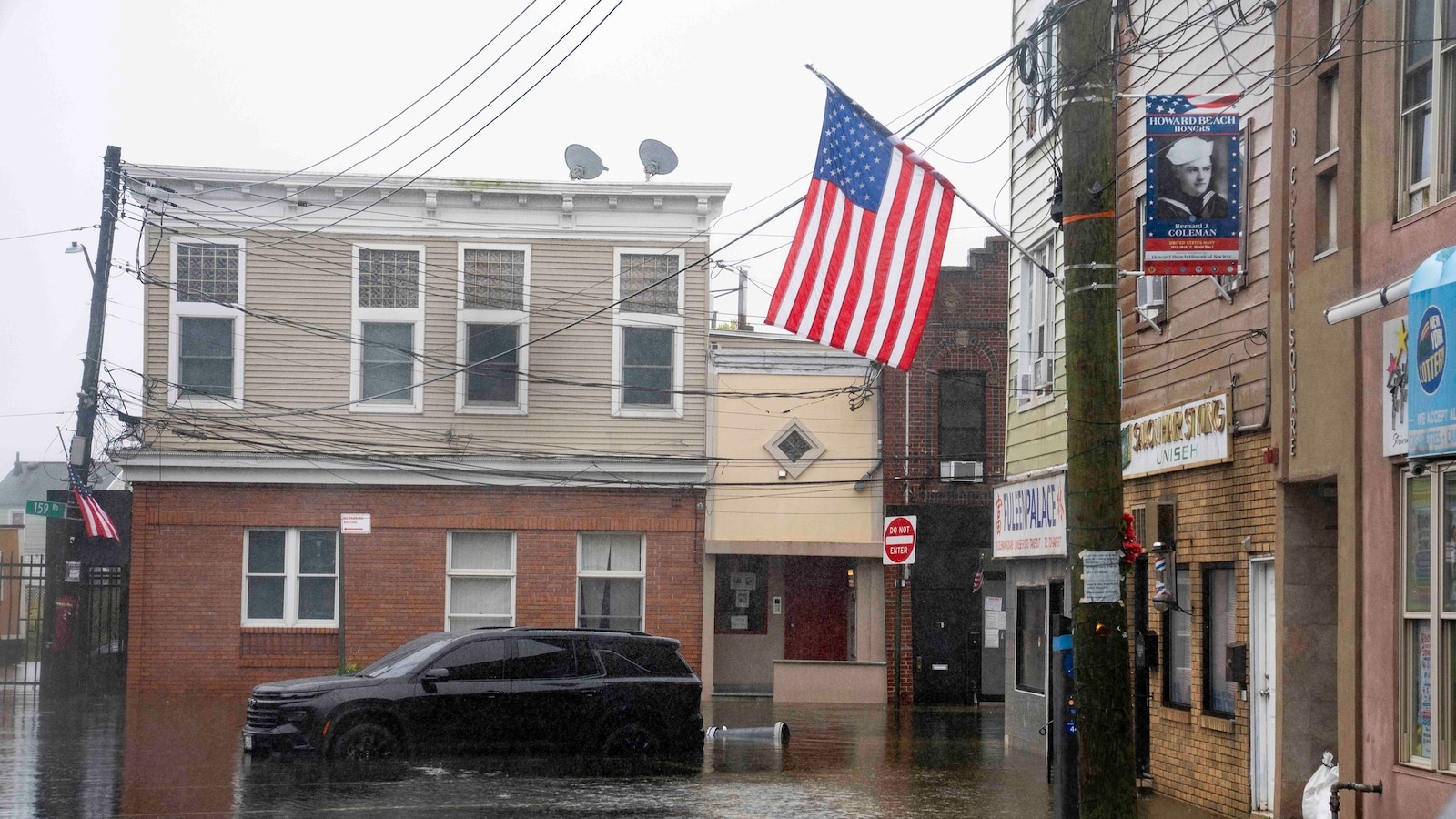 A dogfish shark was spotted swimming through floodwaters in Surf City, New Jersey, heading up a resident's driveway and then toward Barnegat Bay on Saturday. ▻