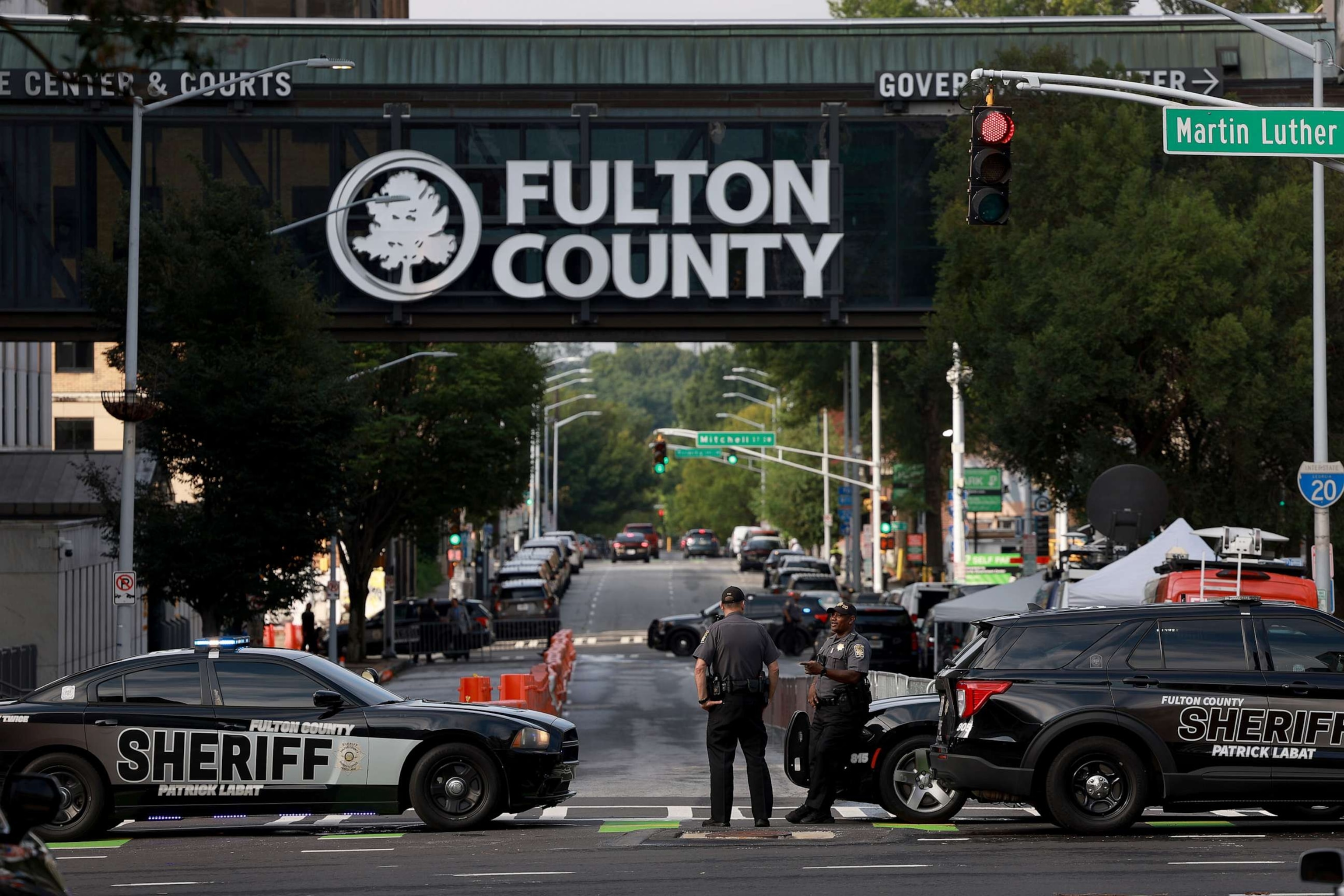 PHOTO: Fulton County Sheriff officers block off a street in front of the Fulton County Courthouse on Aug. 7, 2023 in Atlanta.