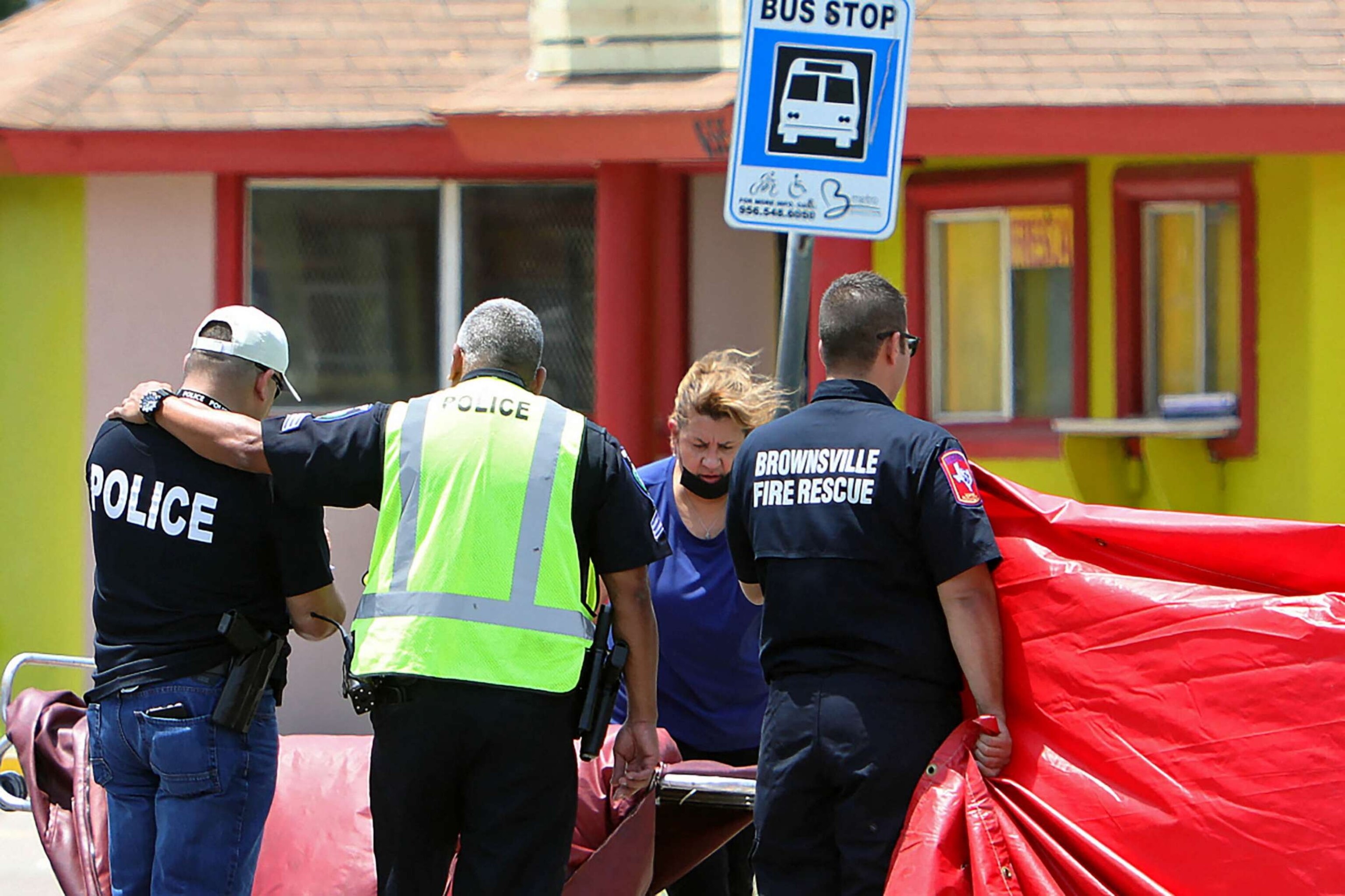 PHOTO: A police officer is consoled after after a deadly incident where a car ran into pedestrians near Ozanam Center, a shelter for migrants and homeless, in Brownsville, Texas, May 7, 2023.