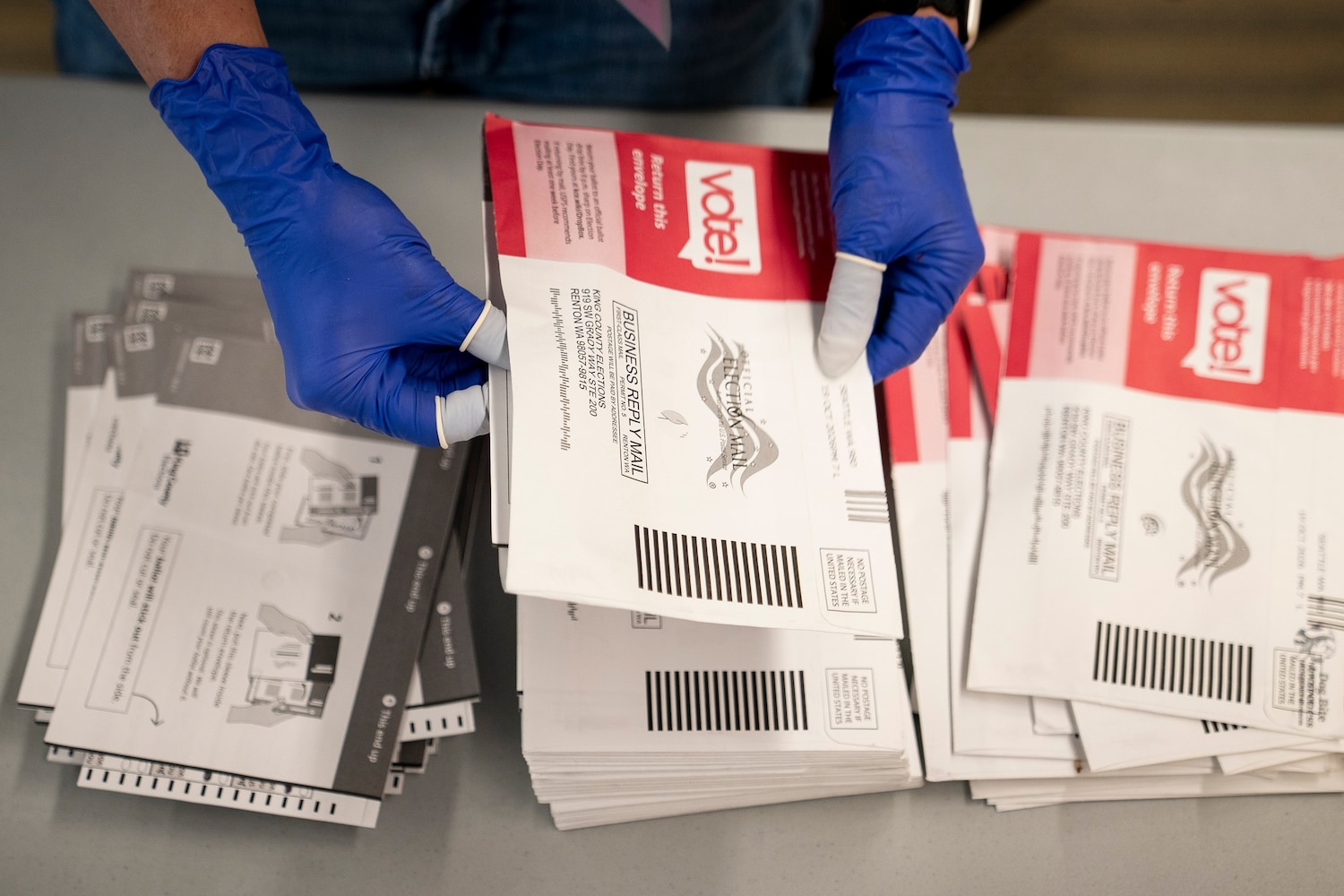 An election worker opens voter ballots for the midterm elections at the King County Elections headquarters on October 23, 2026 in Renton, Washington. David Ryder/Getty Images
