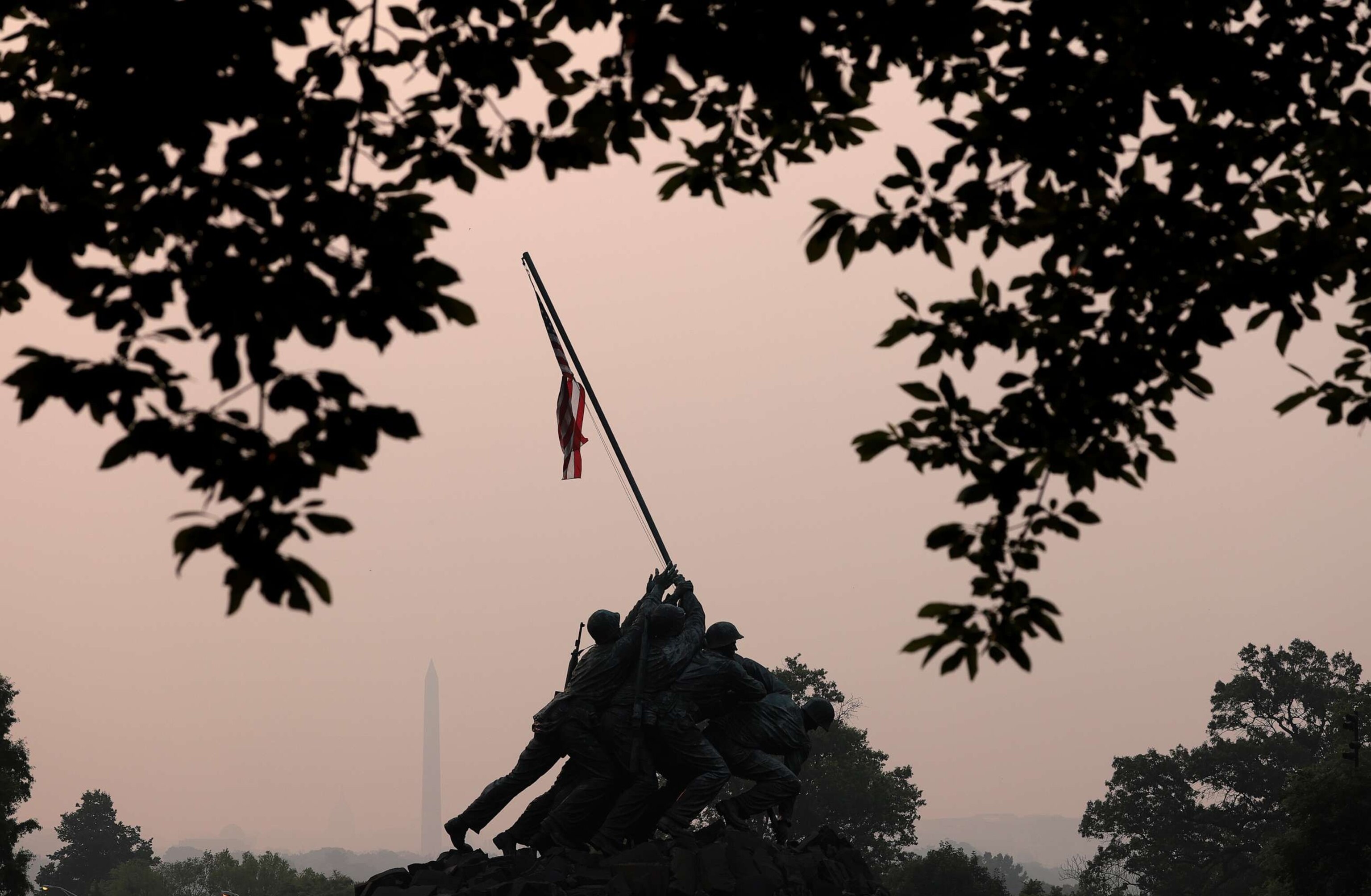 PHOTO: Hazy skies caused by Canadian wildfires blanket the monuments and skyline of Washington, D.C., June 7, 2023, as seen from Arlington, Va.