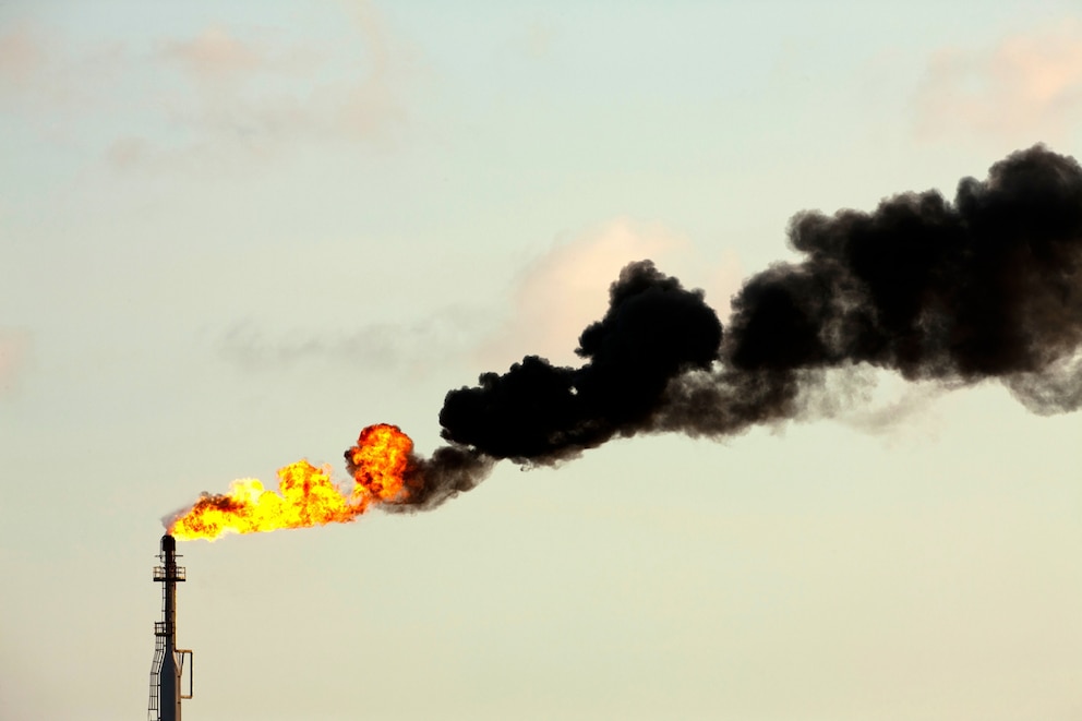 PHOTO: Flames and smoke billow from natural gas flare at an oil refinery