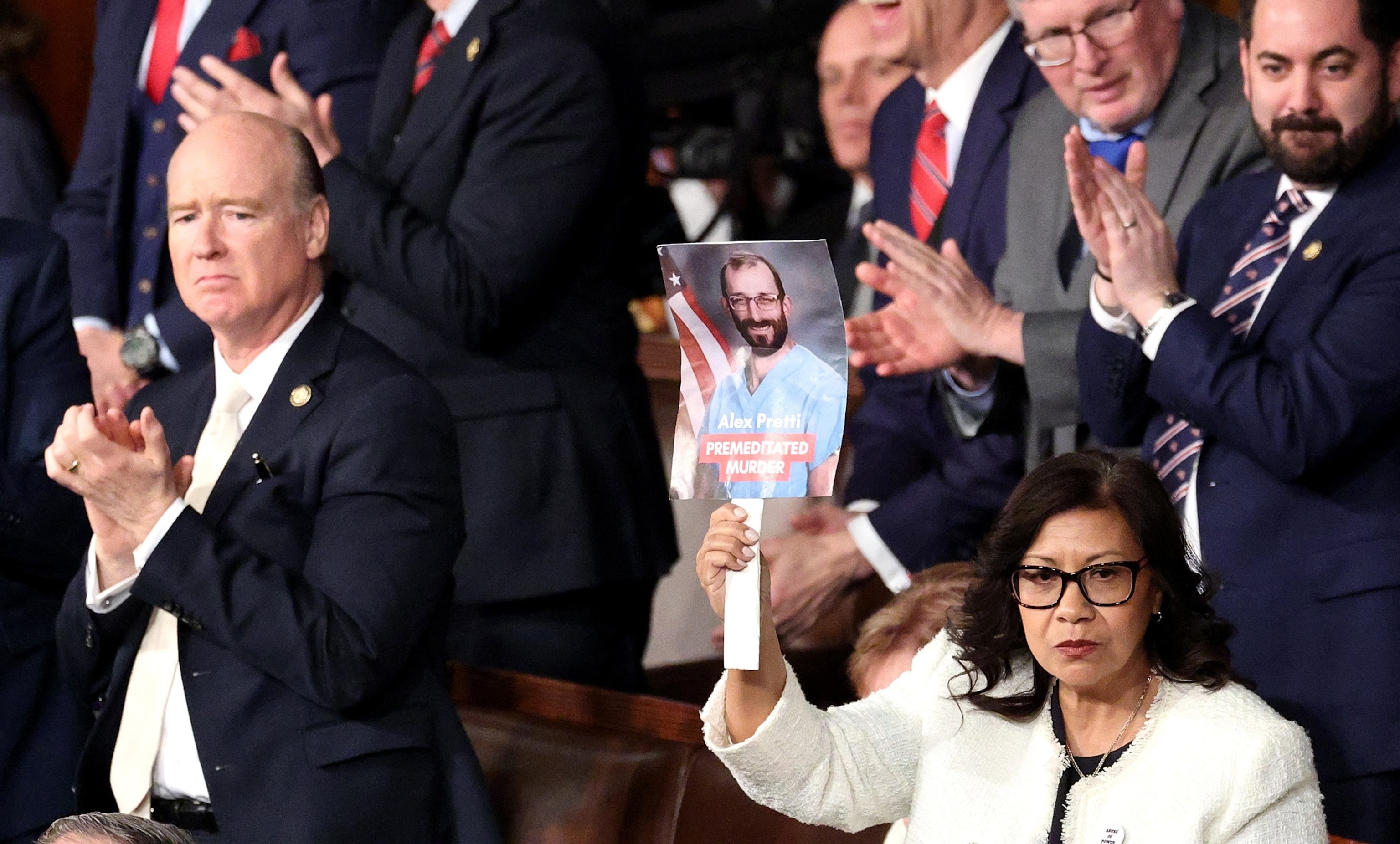 PHOTO: Rep. Norma Torres holds up a photo of Minnesota shooting victim Alex Pretti during a Joint Session of Congress at the U.S. Capitol on Feb. 24, 2026, in Washington, D.C.
