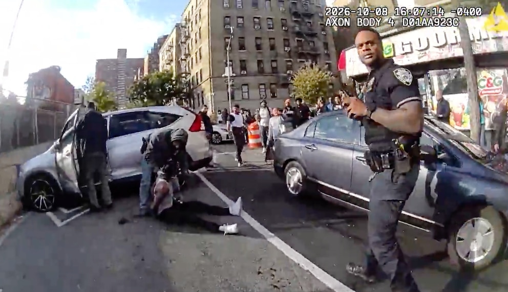 PHOTO: In this image taken from police-worn body camera video released the New York City Police Department (NYPD), law enforcement personnel tend to a Oscar Belgal, 28.
