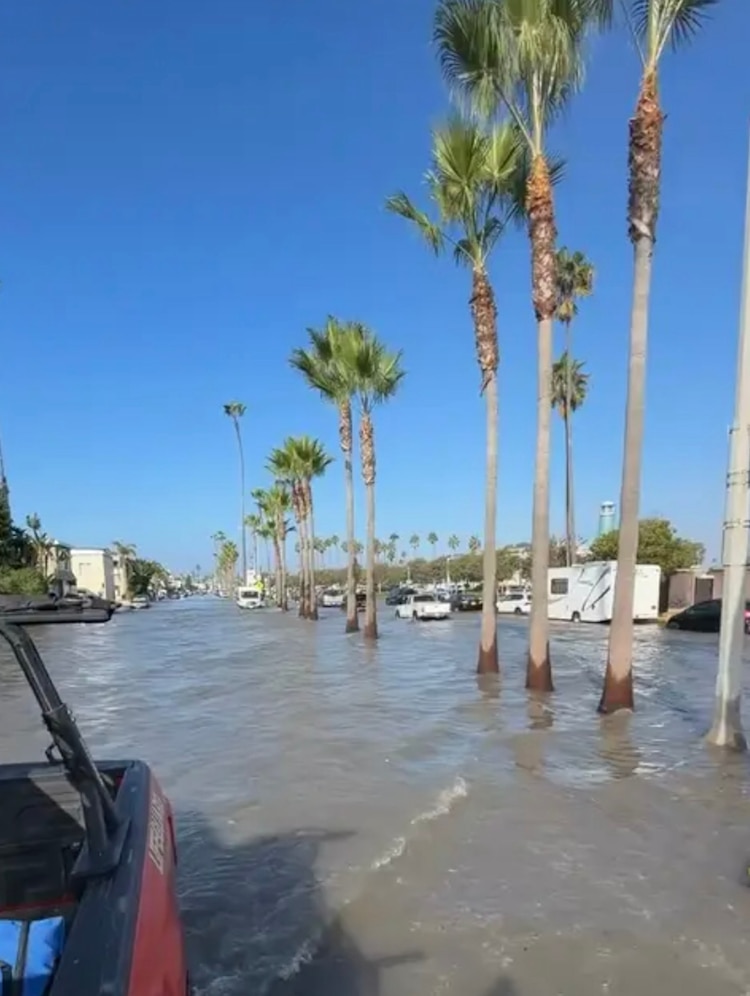 The City of Newport Beach, California, is advising motorists to avoid flooded streets in the coastal community, October 9, 20