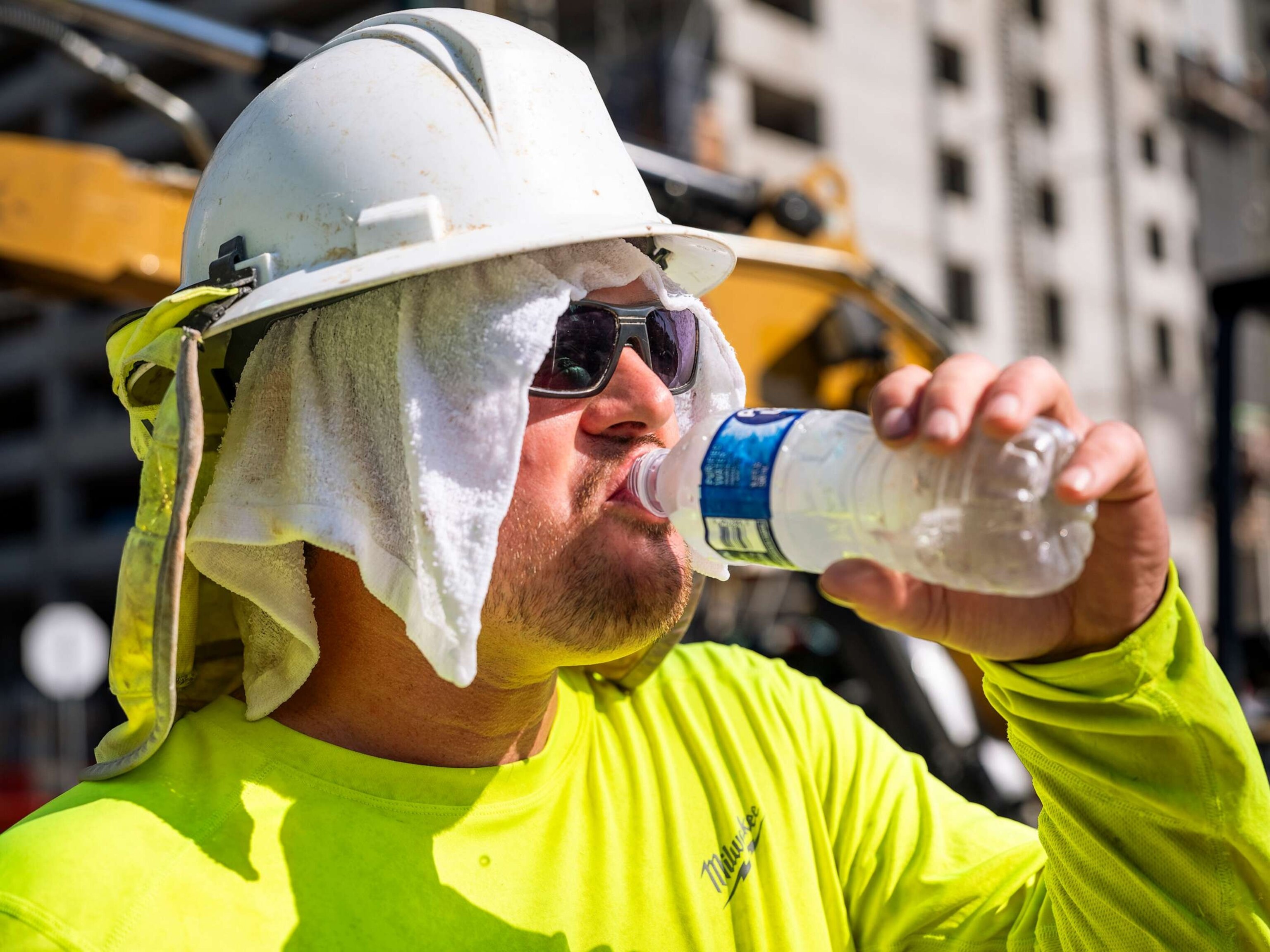 PHOTO: A construction worker drinks to cool down on a hot day in Austin, Texas, on June 27, 2023.