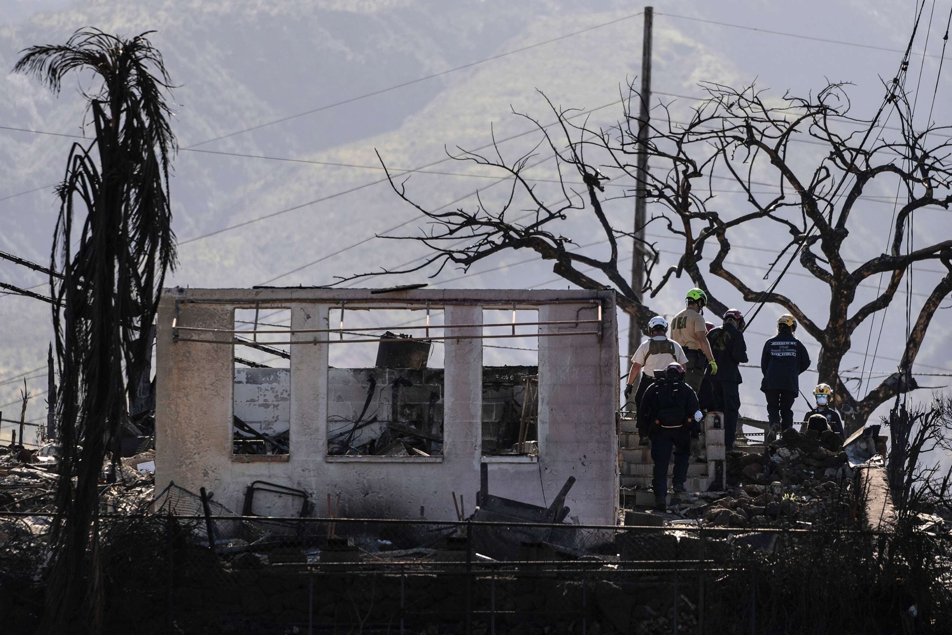 PHOTO: Search and rescue team members work in a residential area devastated by a wildfire in Lahaina, Hawaii, Aug. 18, 2023.