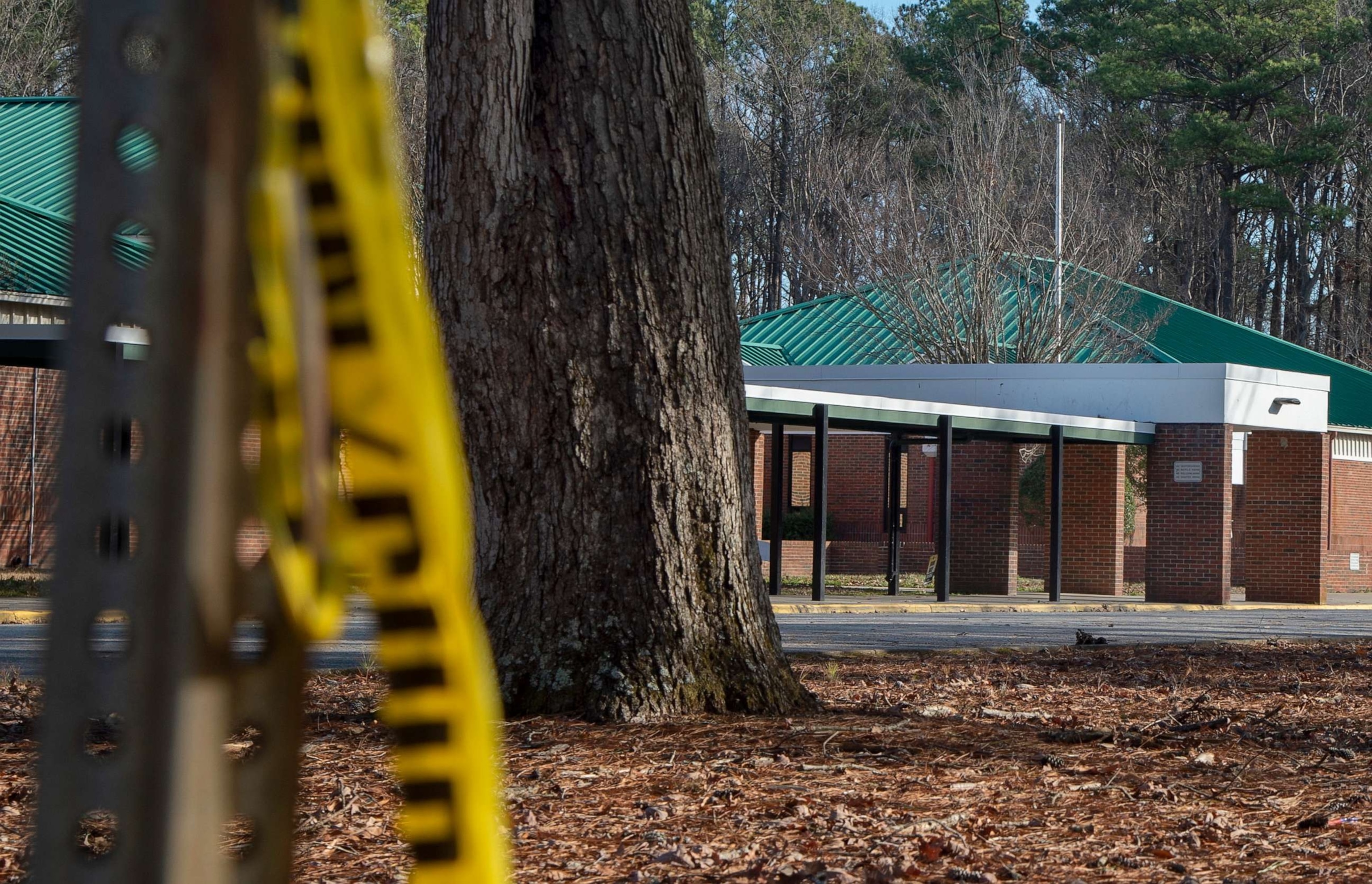 PHOTO: Police tape hangs from a sign post outside Richneck Elementary School, January 7, 2023, in Newport News, Va.