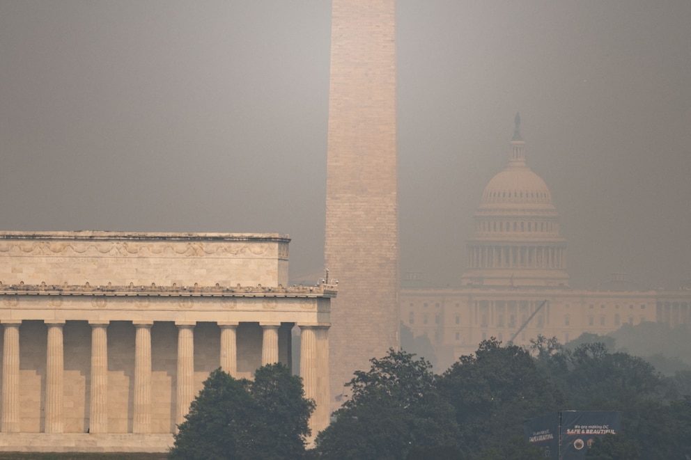 PHOTO: The US Capitol, Washington Monument and Lincoln Memorial are seen through haze caused by wildfire smoke from Canada from the Netherlands Carillon in Arlington, Virginia on July 17, 2026.
