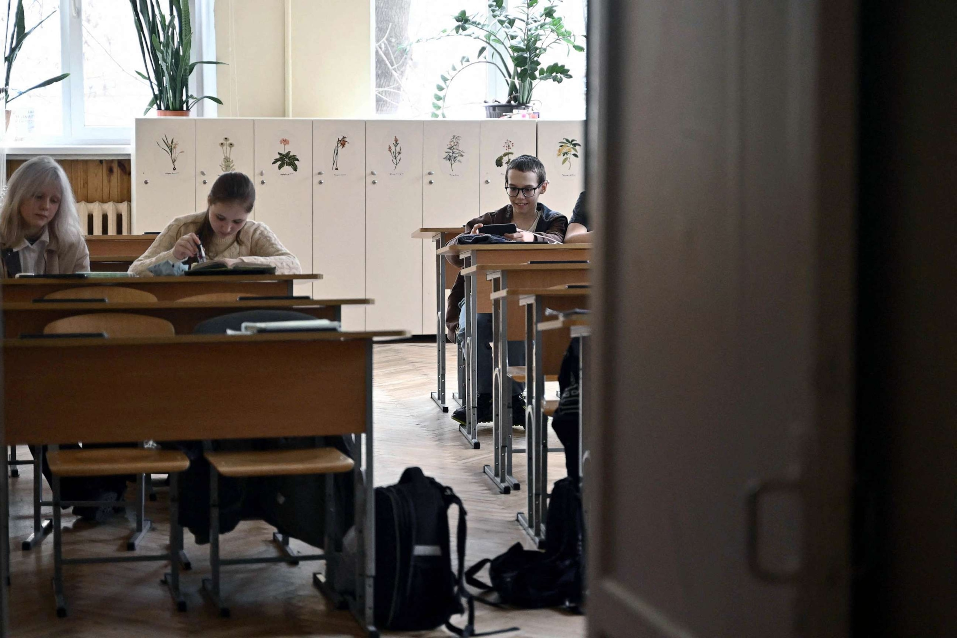 PHOTO: FILE - School children back in a classroom after an all-clear signal in a school in Kyiv, March 23, 2023, amid the Russian invasion of Ukraine.