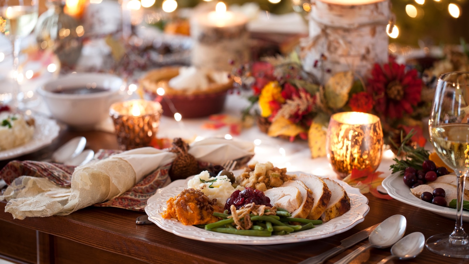 Stock image of a Thanksgiving dinner table.