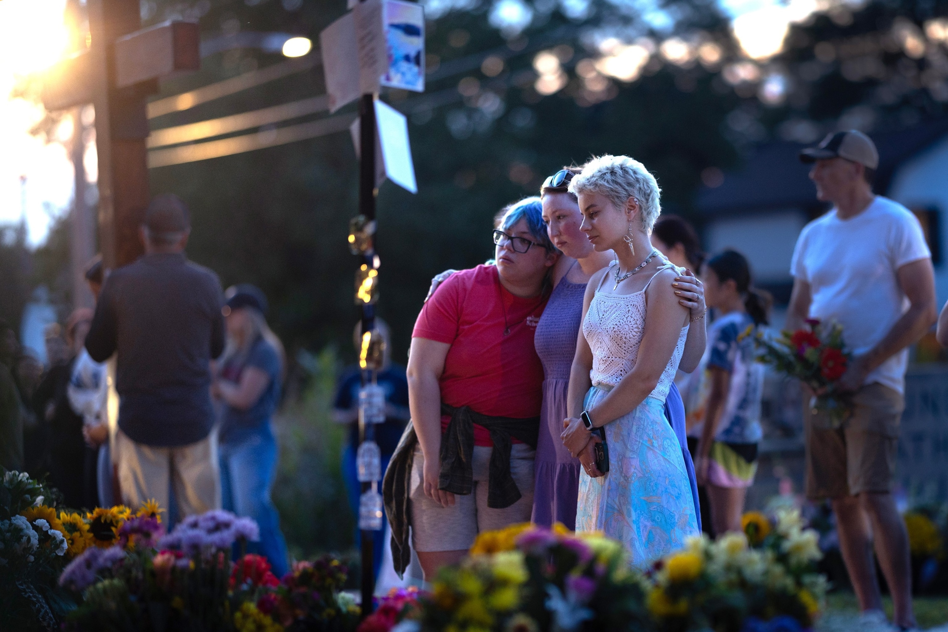 PHOTO: People gather at a memorial for victims of yesterday's shooting in front of Annunciation Catholic Church, August 28, 2025 in Minneapolis.