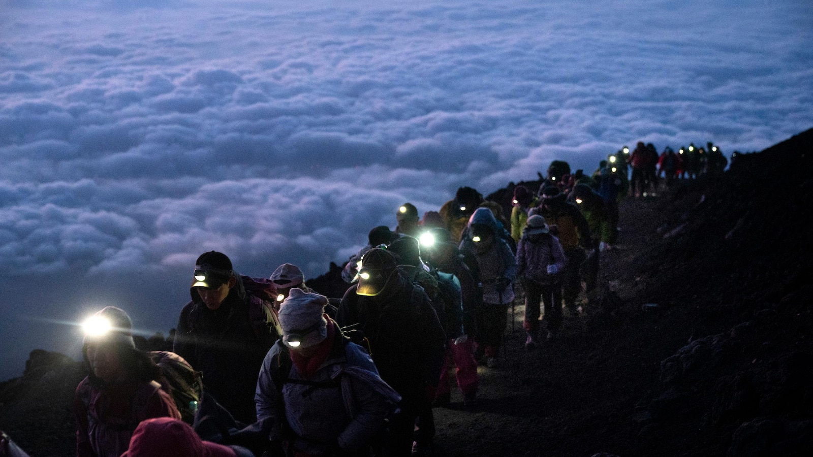 Climbing limits are being set on Mount Fuji to fight crowds and littering Climbing limits are being set on Mount Fuji to fight crowds and littering