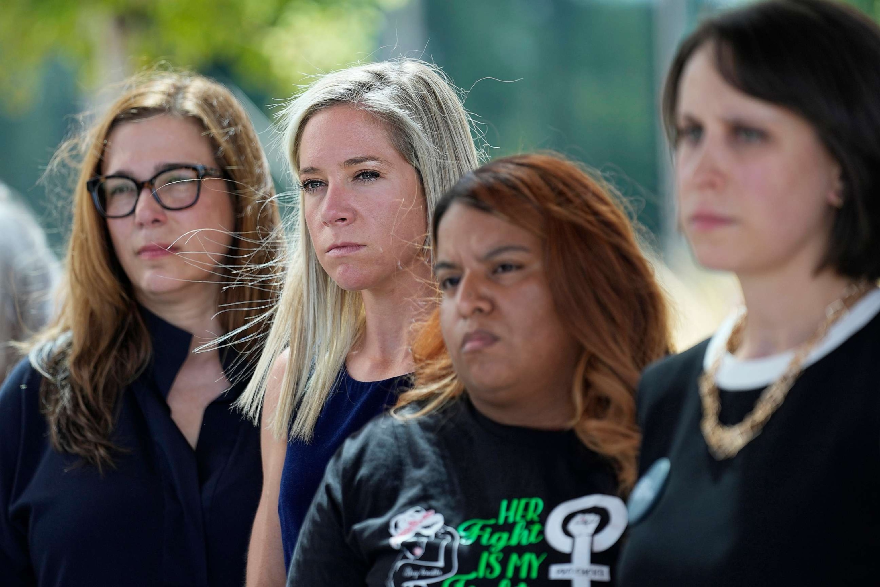 PHOTO: Amanda Zurawski, second from left, and Samantha Casiano, second from right, stand with other plaintiffs and their attorneys outside the Travis County Courthouse, July 19, 2023, in Austin, Texas.