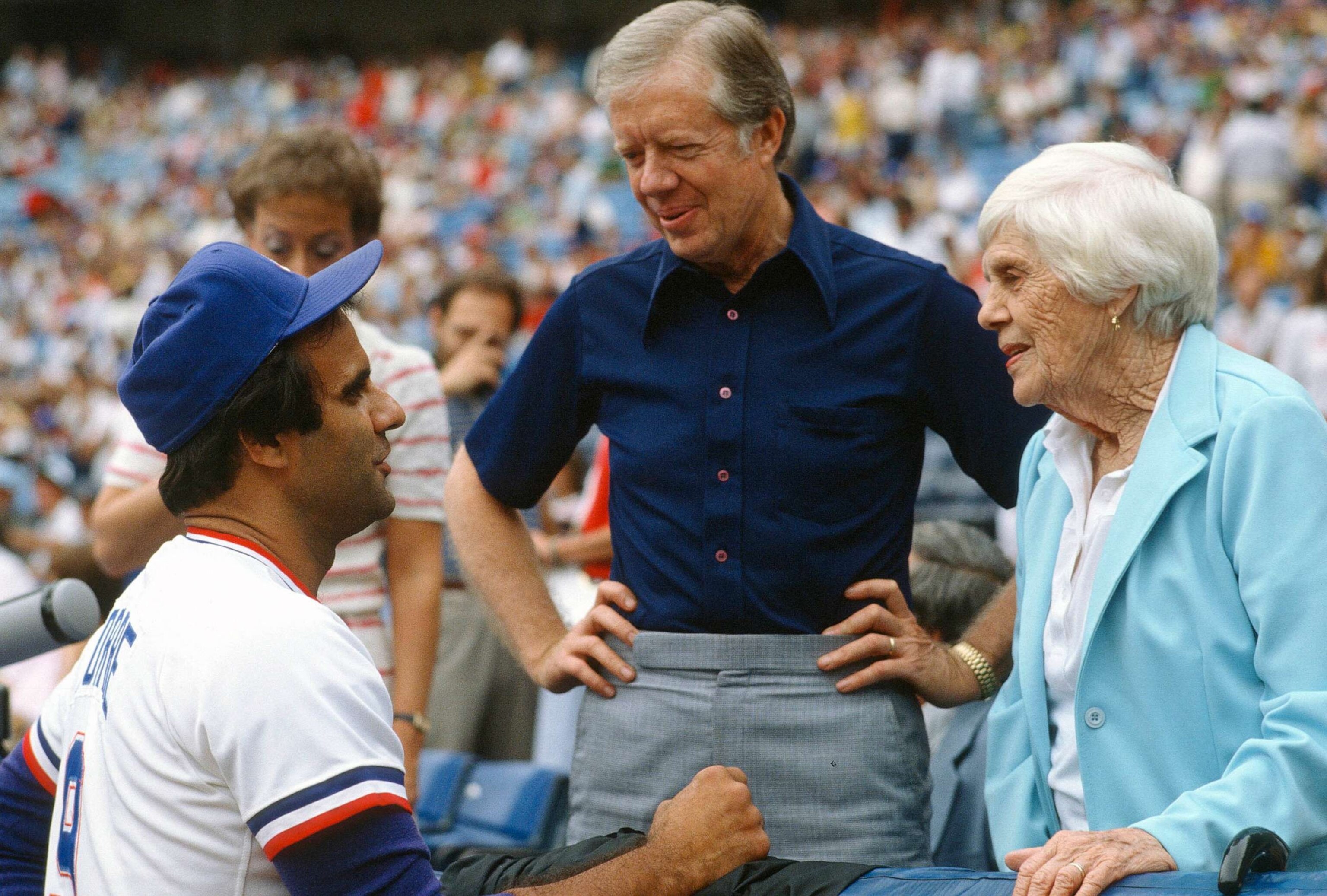 PHOTO: FILE - Manager Joe Torre #9 of the Atlanta Braves talks with former President Jimmy Carter and former First Lady Rosalynn Carter prior to the start of an Major League Baseball game circa 1983 at Atlanta-Fulton County Stadium in Atlanta.