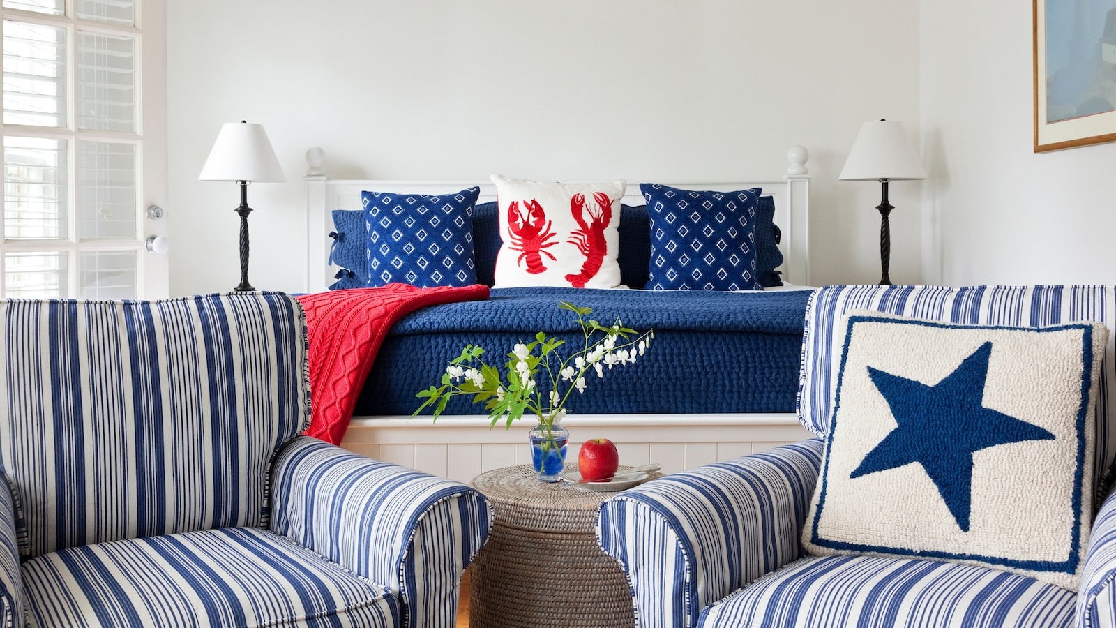 Red white and blue decor in bedroom at the Inn at Sunrise Point, Camden, Maine.