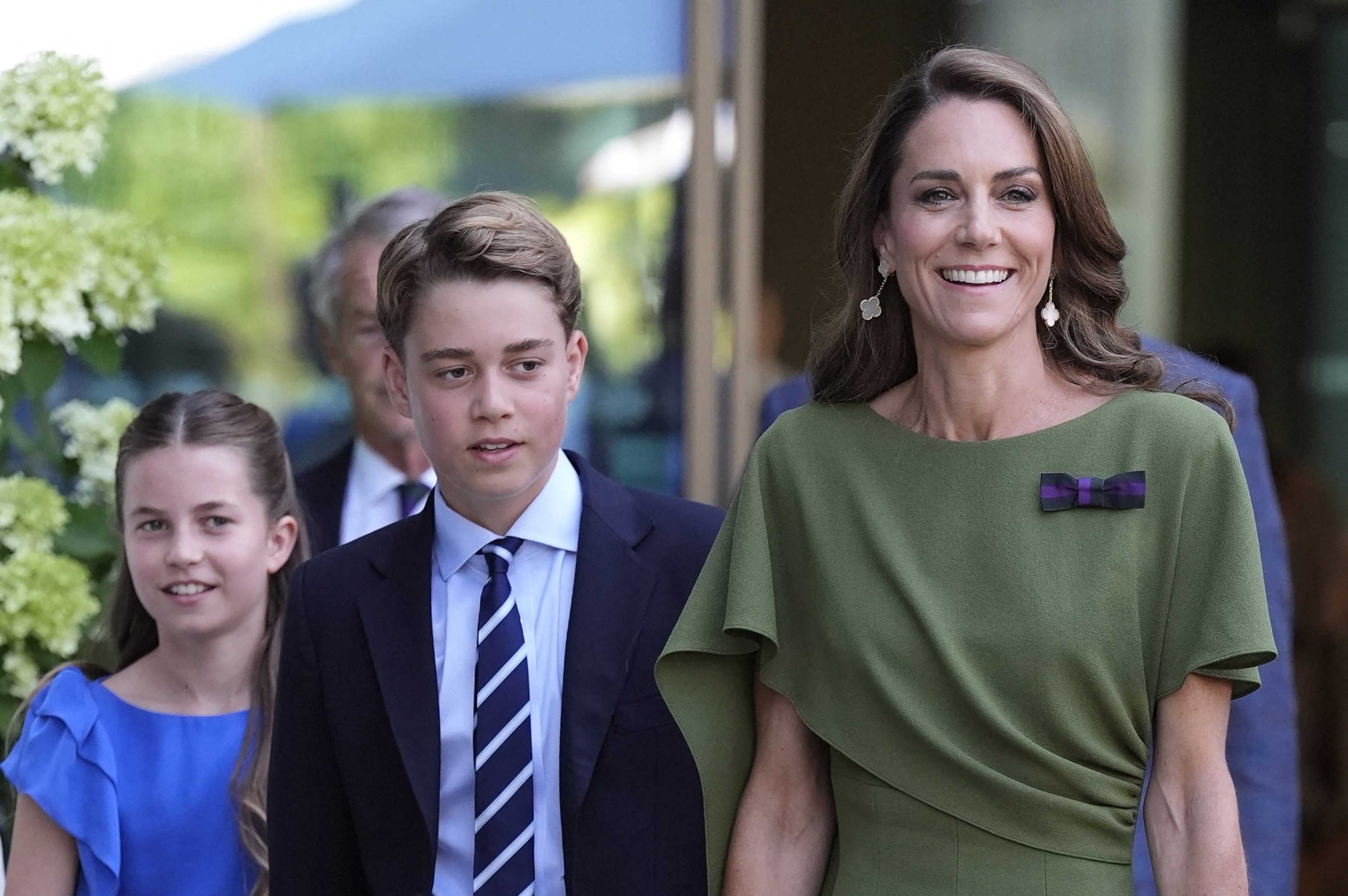 Britain's Catherine, Princess of Wales (R), Britain's Prince George of Wales (C) and Britain's Princess Charlotte of Wales arrive on the last day of the 2026 Wimbledon Championships in Wimbledon, southwest London, on July 12, 2026.