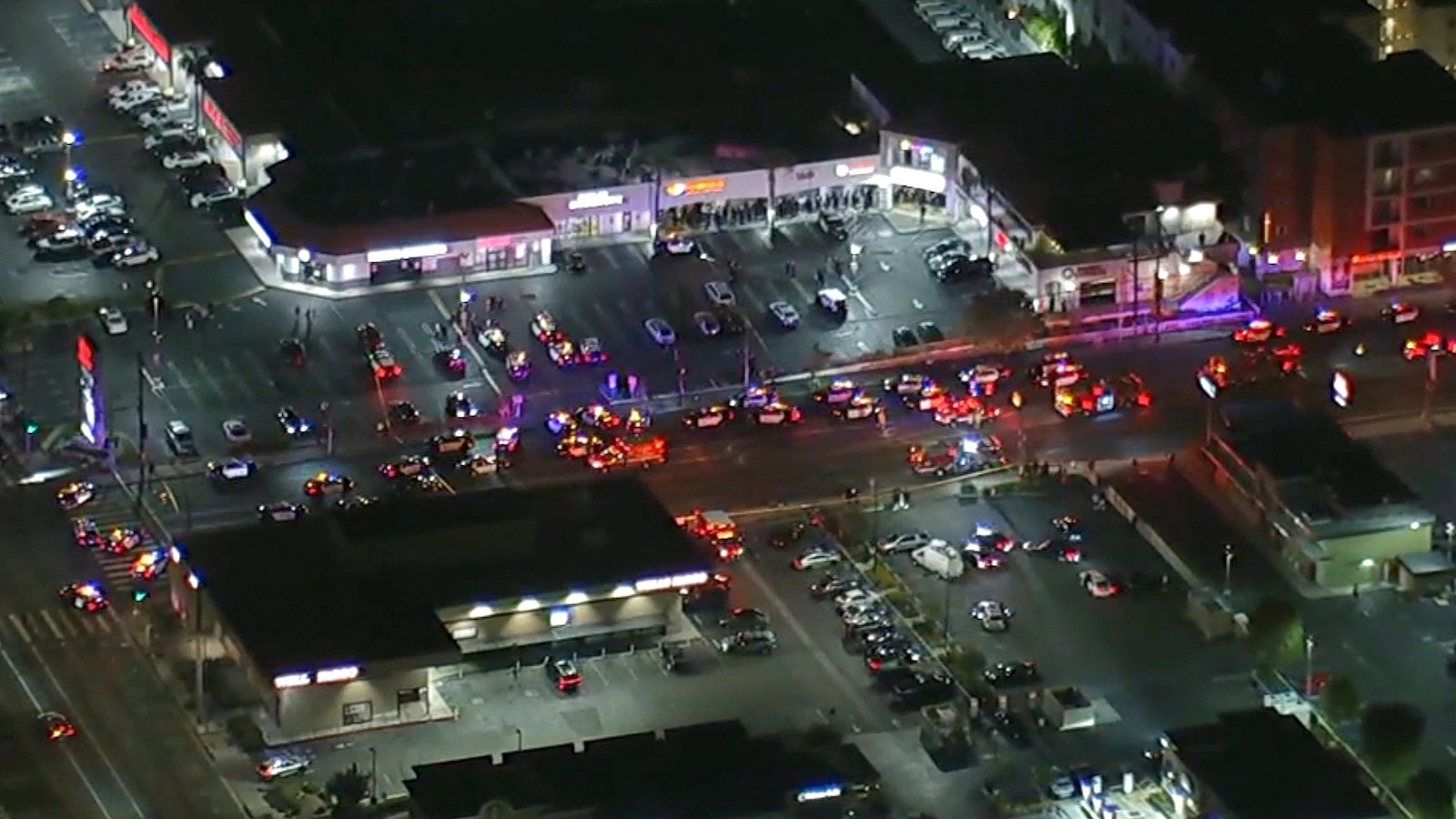 At least two people were killed Friday in a shooting at a Los Angeles strip mall, according to police.