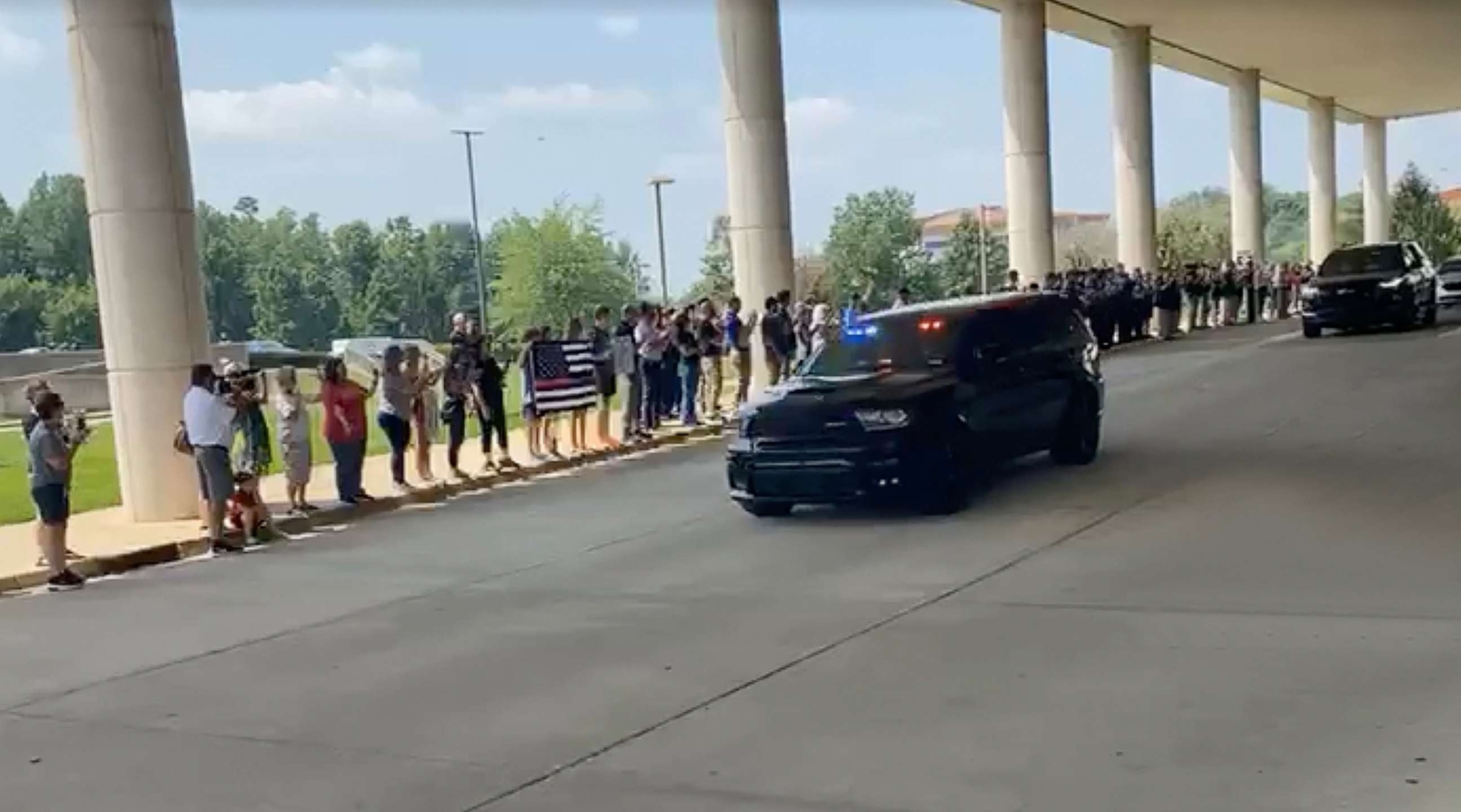 PHOTO: The Louisville community gathered to cheer on officer Nickolas Wilt as he and his family headed home, July 28, 2023.