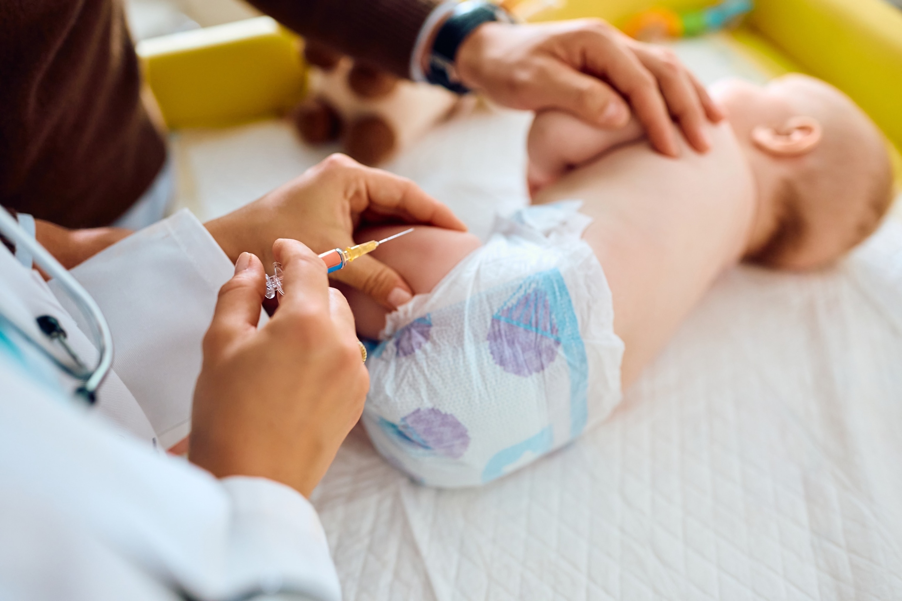 PHOTO: A baby receives an injection from a doctor in an undated stock photo. 