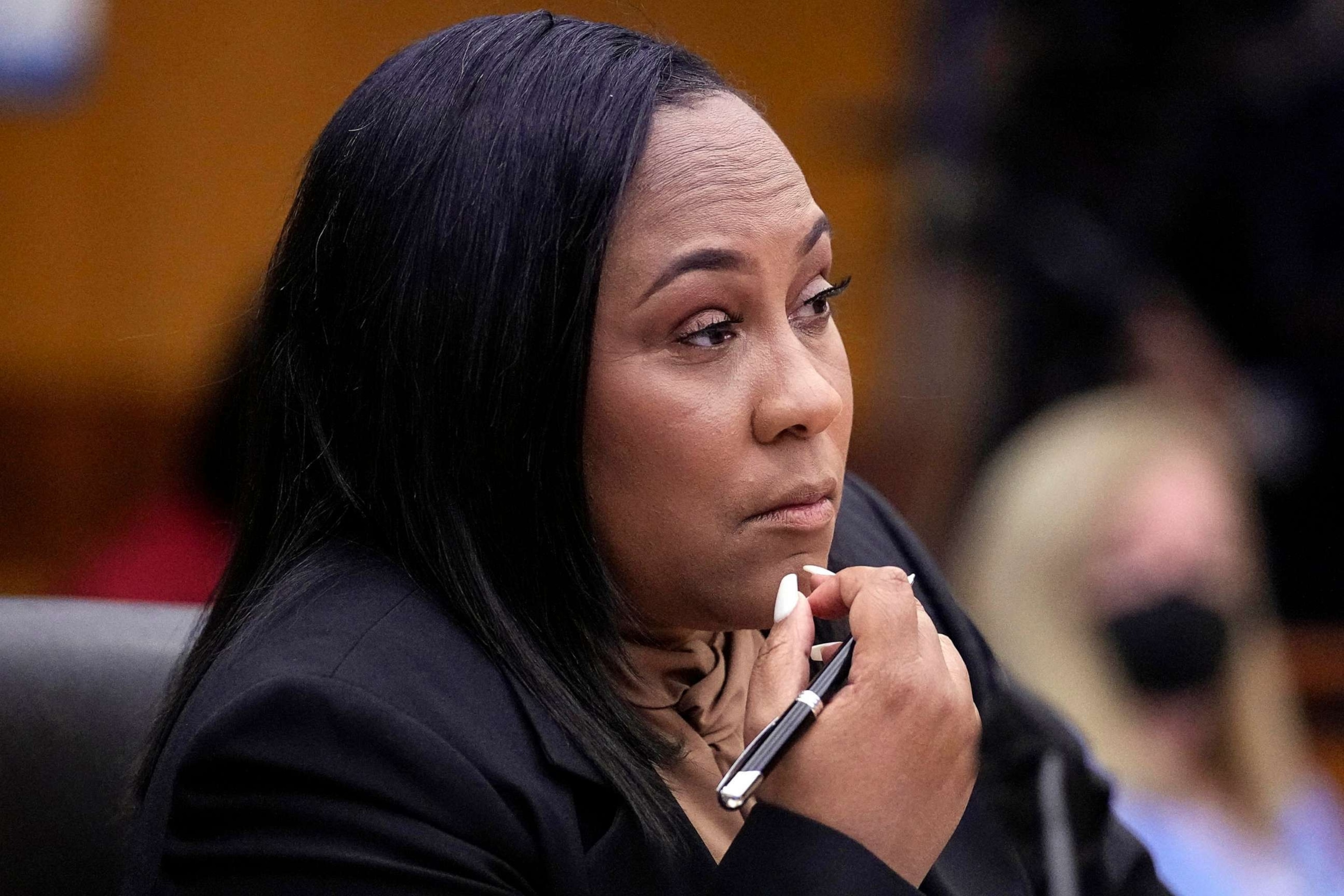 PHOTO: FILE - Fulton County District Attorney Fani Willis watches proceedings during a hearing to decide if the final report by a special grand jury looking into possible interference in the 2020 presidential election can be released Jan. 24, 2023, in