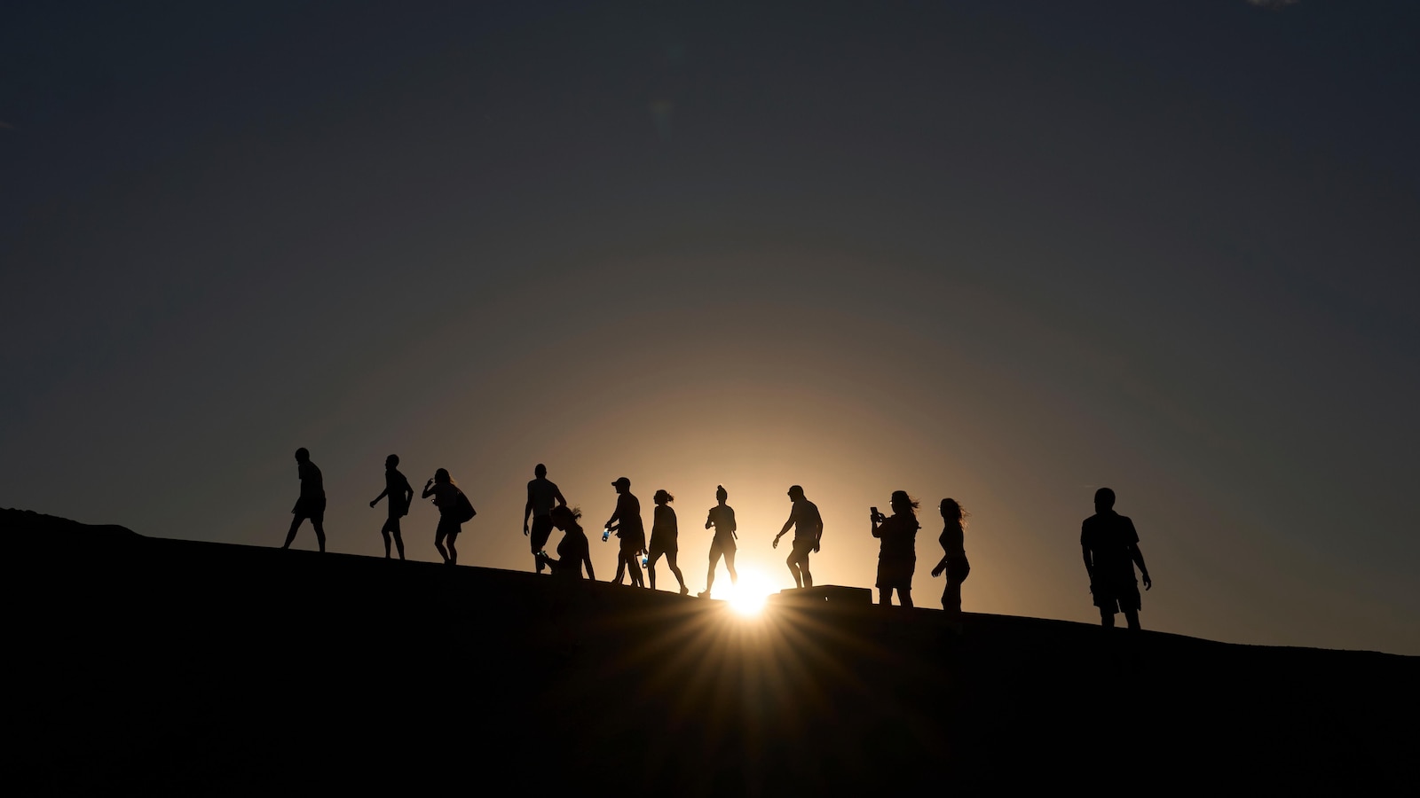Searing heat draws visitors to Death Valley, where it's tough to communicate risks