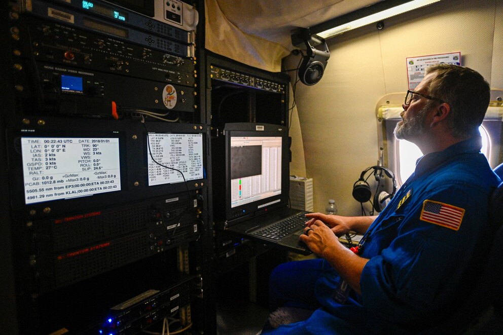 PHOTO: In this May 6, 2025, file photo, a crew member looks at a laptop inside a NOAA WP-3D Orion Hurricane Hunter research plane during a media day at the National Oceanic and Atmospheric Administration's Aircraft Operations Center in Lakeland, Fla.