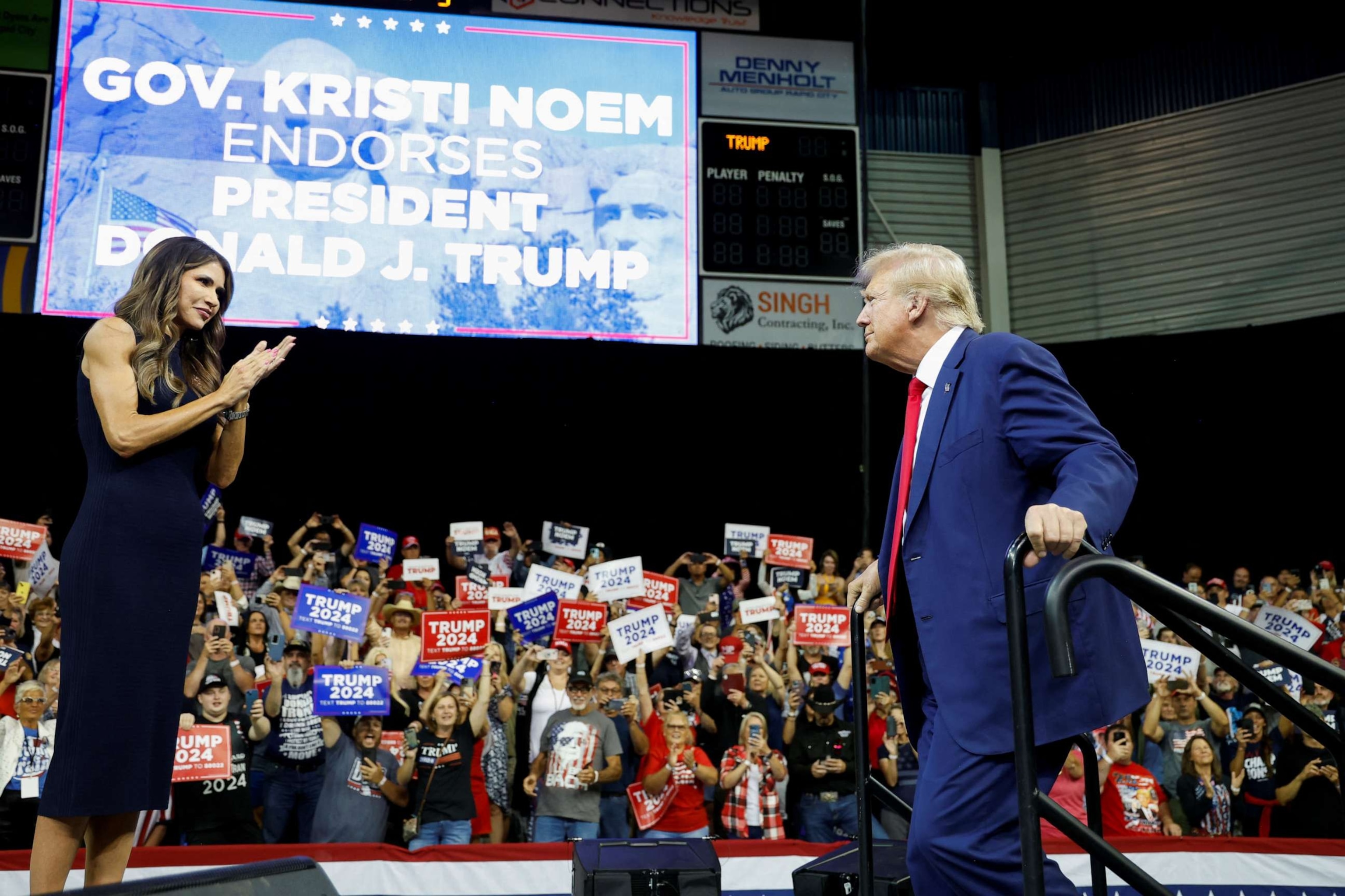 South Dakota Governor Kristi Noem welcomes former U.S. President and Republican presidential candidate Donald Trump in Rapid City, South Dakota, U.S. September 8, 2023. REUTERS/Jonathan Ernst