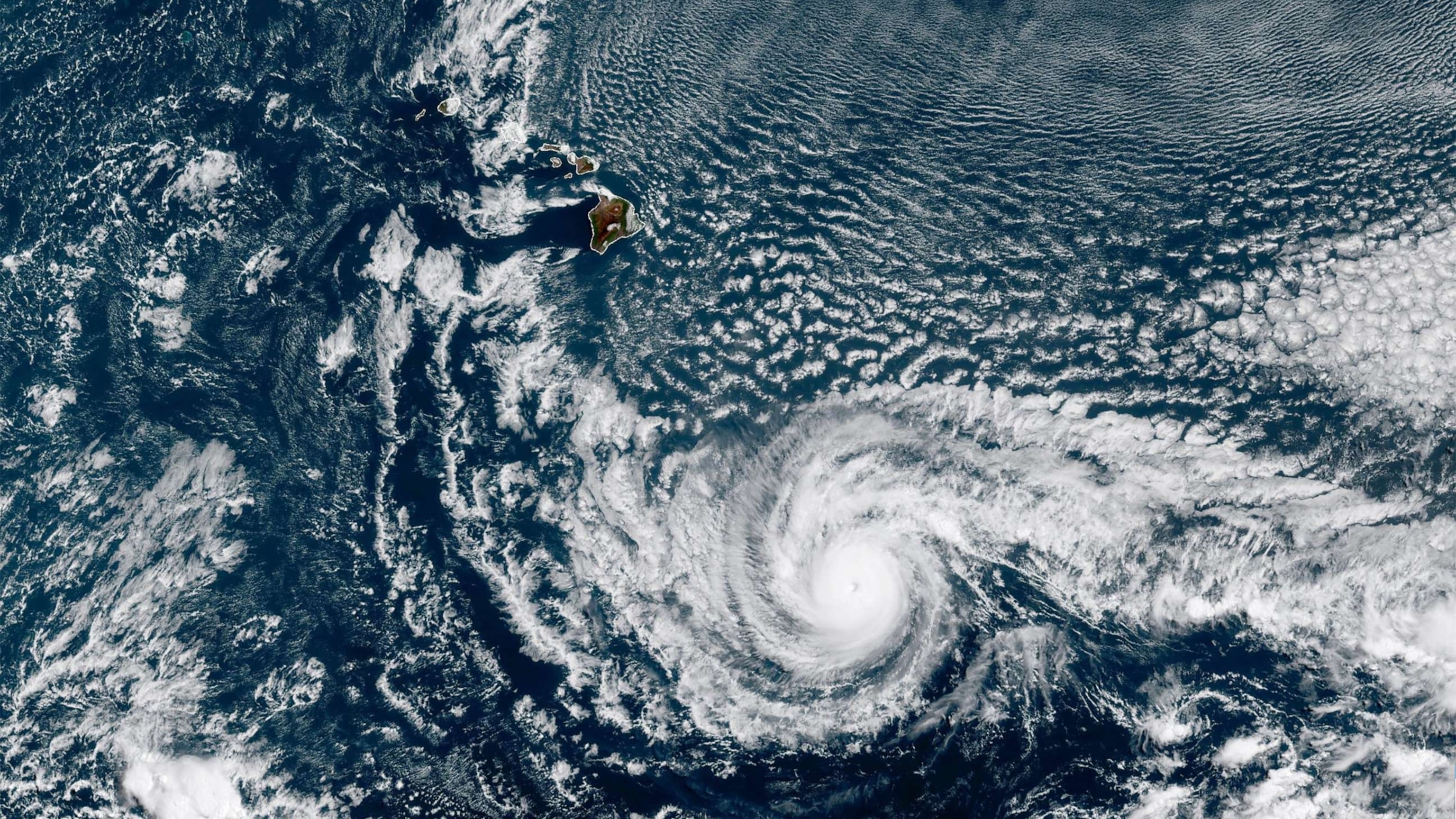 PHOTO: A satellite image of Hurricane Dora passing just south of Hawaii's Big Island, Aug. 7. 2023. Dora was moving west at 23 mph. with maximum sustained winds of 130 mph