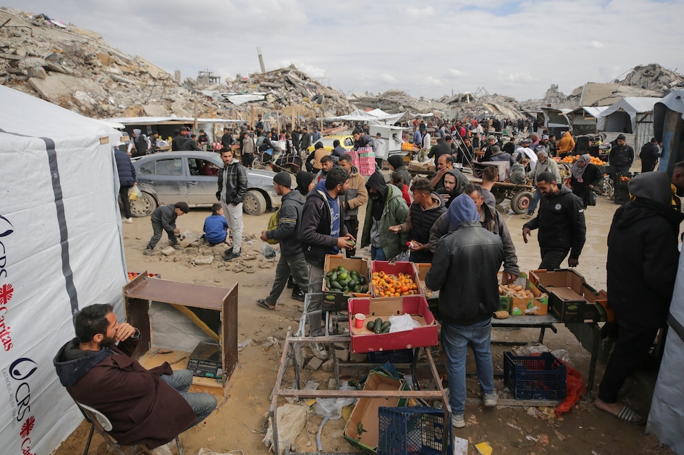 PHOTO: Palestinians purchase goods at a makeshift market set up amid widespread destruction caused by the Israeli military's ground and air offensive in Gaza City's Jabaliya refugee camp,  Feb. 7, 2025. 