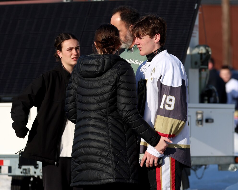 PHOTO: Parents and players congregate near the Lynch Arena in Pawtucket, R.I., after a shooting at the ice rink,  Feb. 16, 2026. 