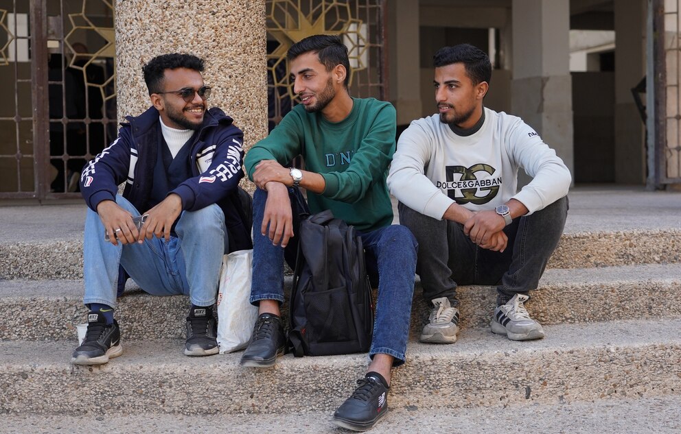 PHOTO: Abdul Rahman Abu Amer, a student at the Faculty of Dentistry at Al-Azhar University in Gaza, sits on one of the university's amphitheaters with his classmates.