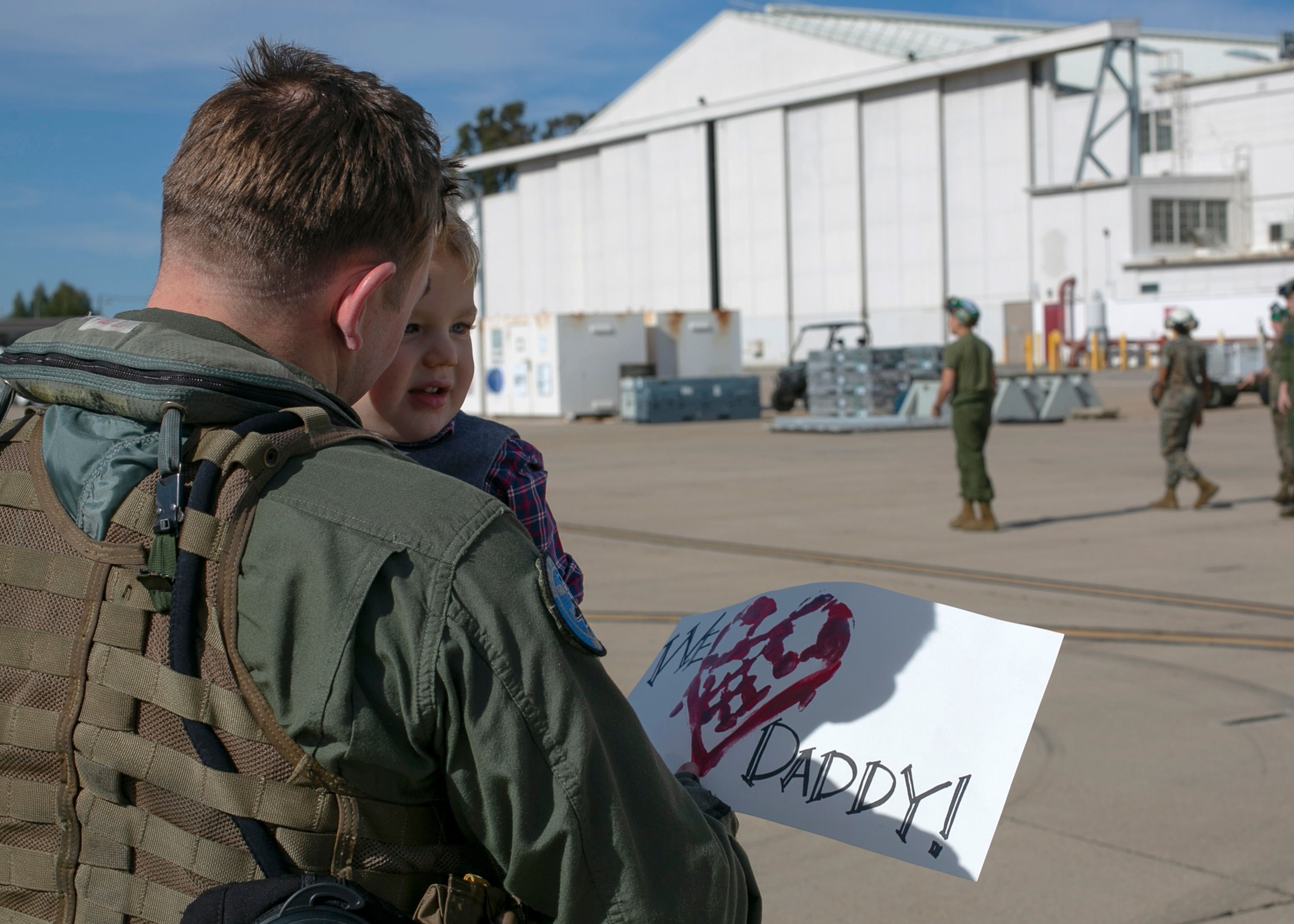 PHOTO: U.S. Marine Corps Maj. Andrew Mettler, an F/A-18 pilot, holds his son at Marine Corps Air Station in Miramar, Calif., on March 15, 2019, following a six-month Unit Deployment Program in Japan.