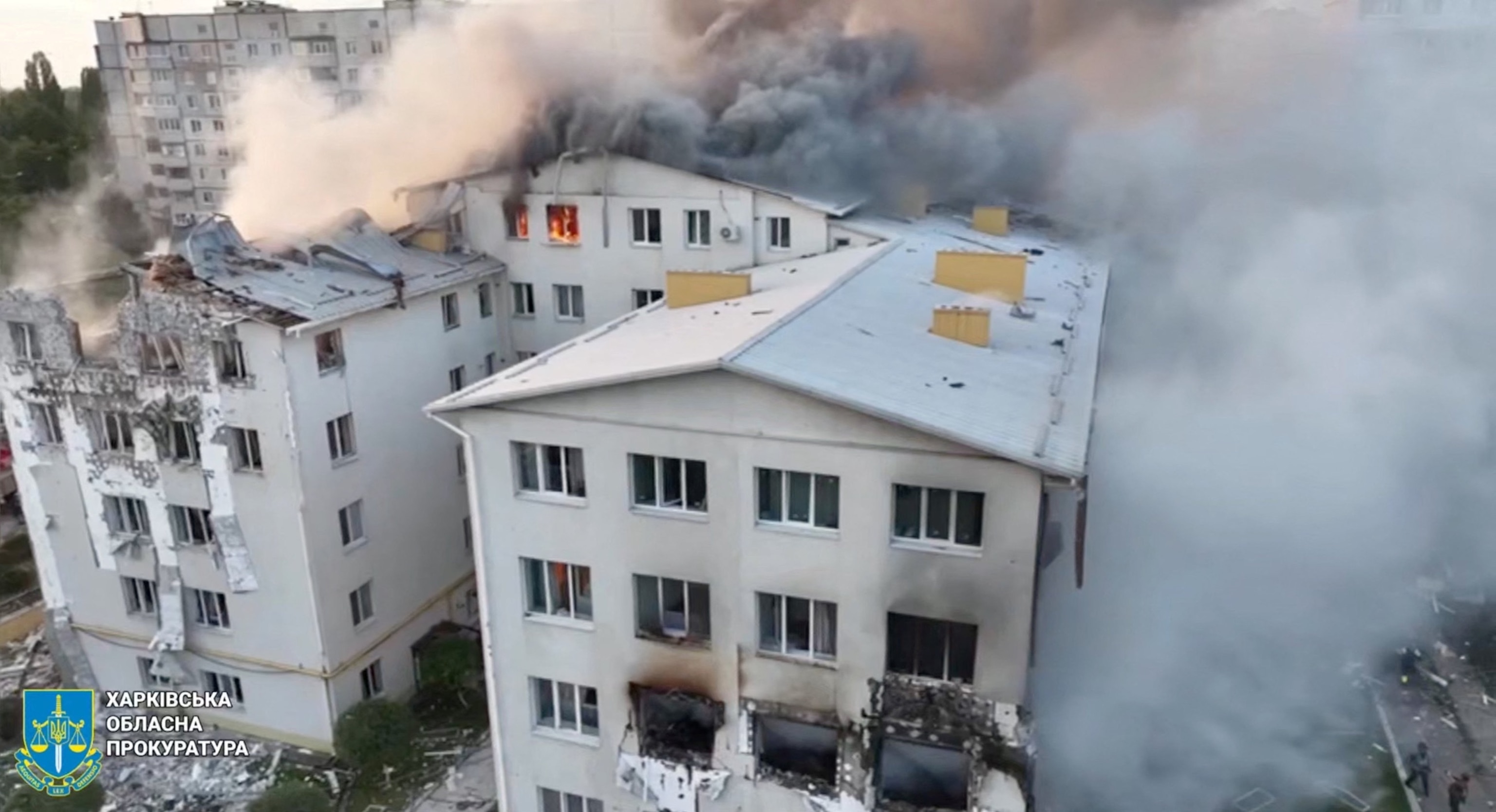 PHOTO: A drone view shows smoke rising from damaged buildings, at the site of an apartment building hit by a Russian drone strike, amid Russia's attack on Ukraine, at a location given as Kharkiv, Ukraine, on Aug. 18, 2025. 