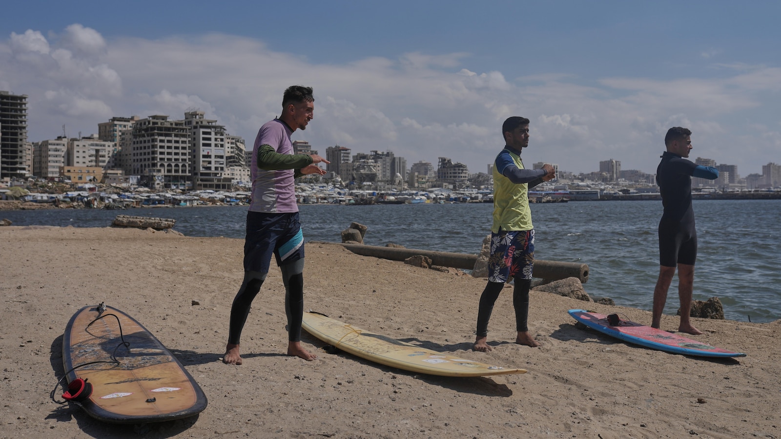 Surfers in war-torn Gaza find rare moments of joy taking to the waves